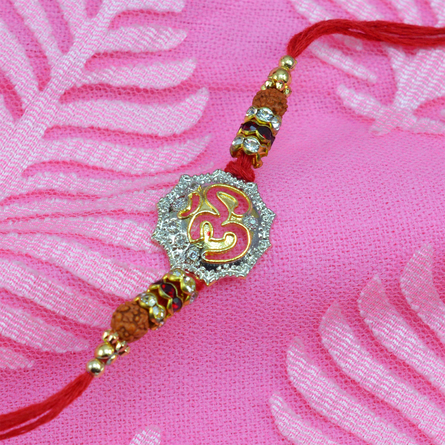 Divine Om rakhi with Rudraksha and studded Diamonds