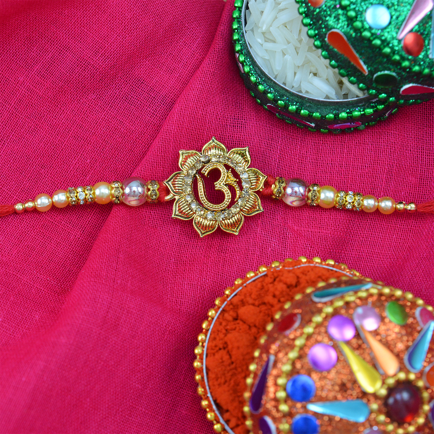 Floral Shape Om Rakhi with Glass work Pearls