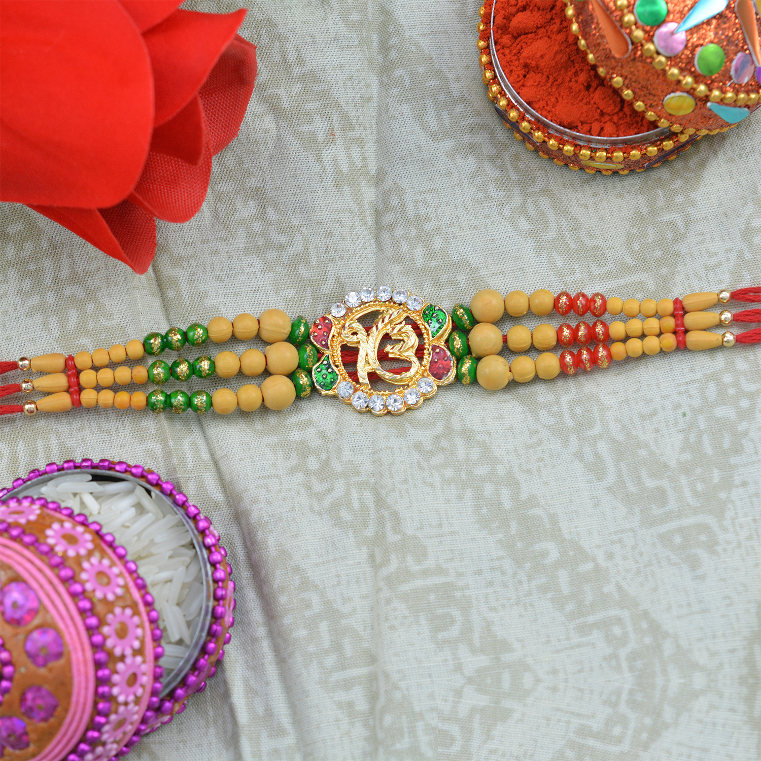 Golden Onkar Rakhi with Sandalwood Designer Beads
