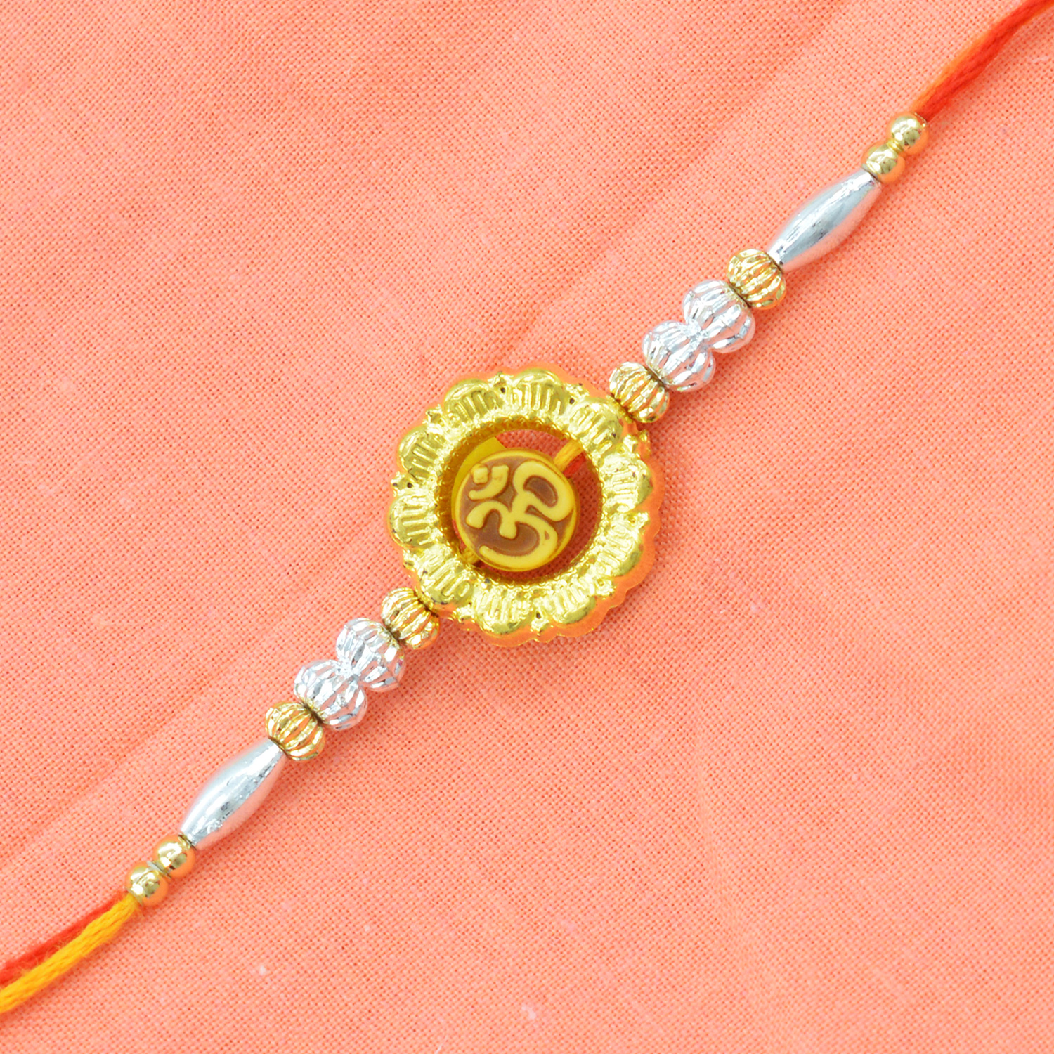 Golden Rakhi With Inner Om And White Beads