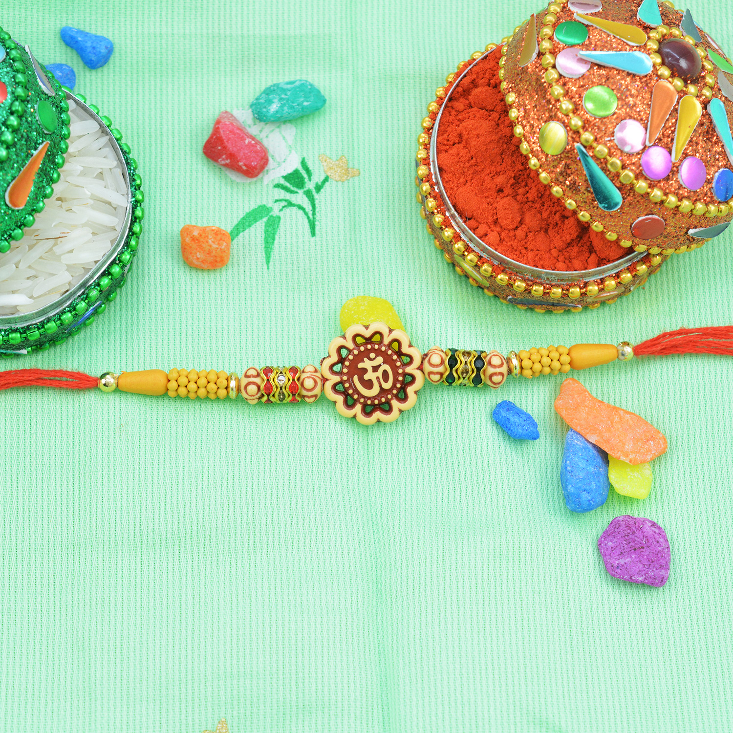 Floral shape Om rakhi in sandalwood and Beads