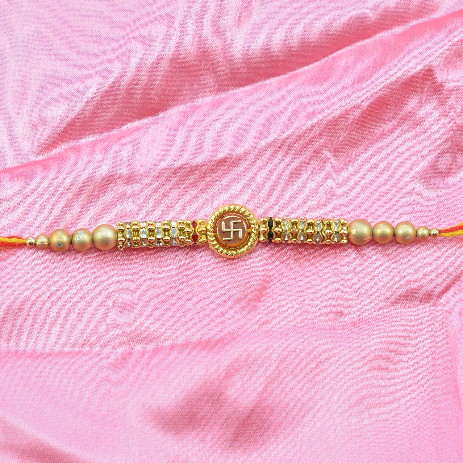 Swastik Rakhi in Round Dial with Multicolor Beads and Golden Color Pearls