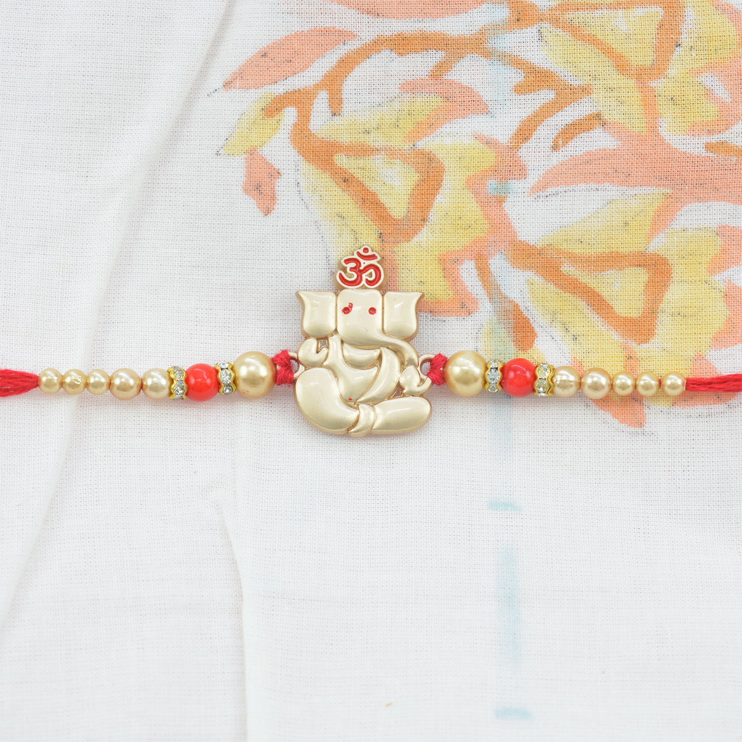 Beautiful Ganesha rakhi With Om and Pearls