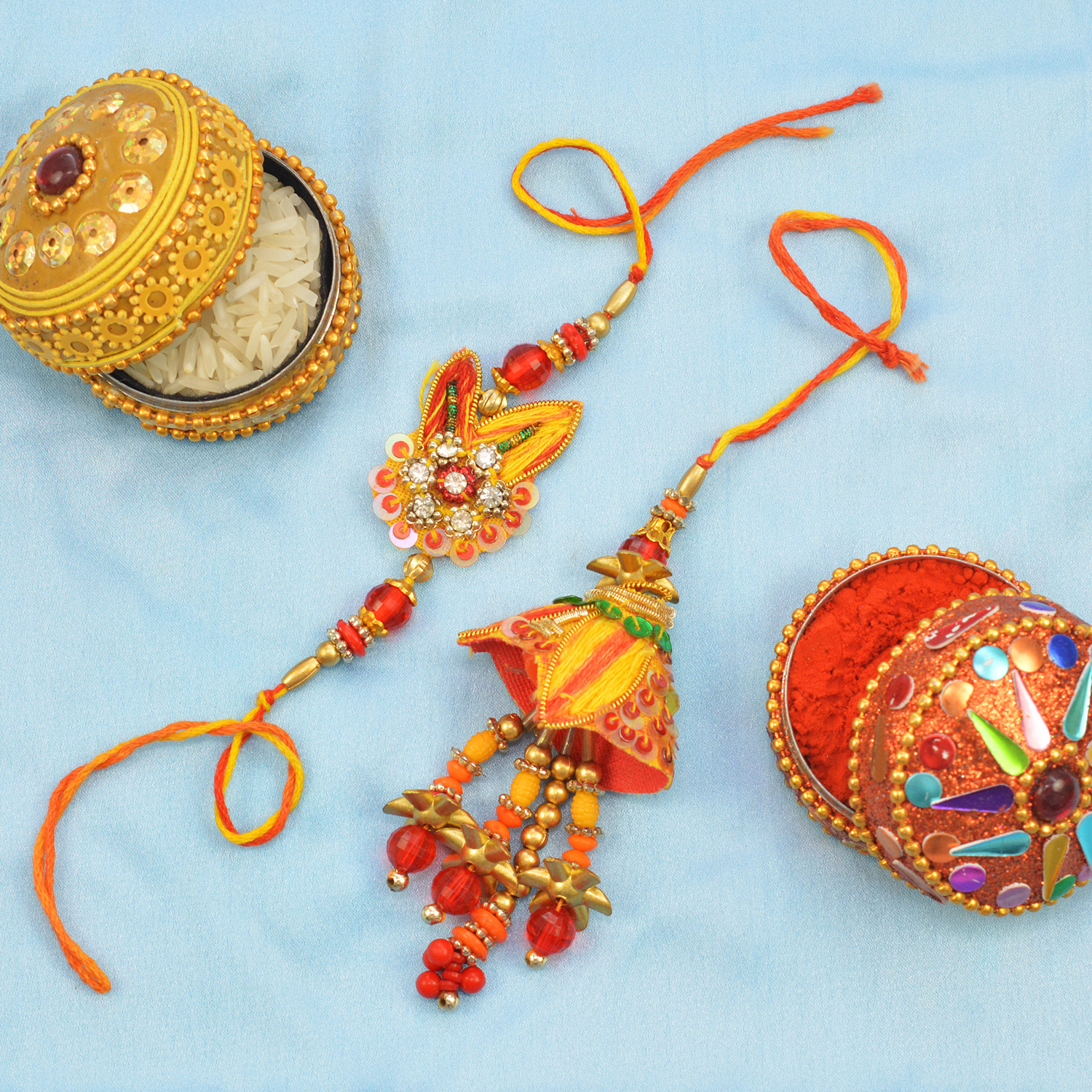 Orange and Red Colored Antique Design Bhaiya and Bhabhi Set of Rakhis