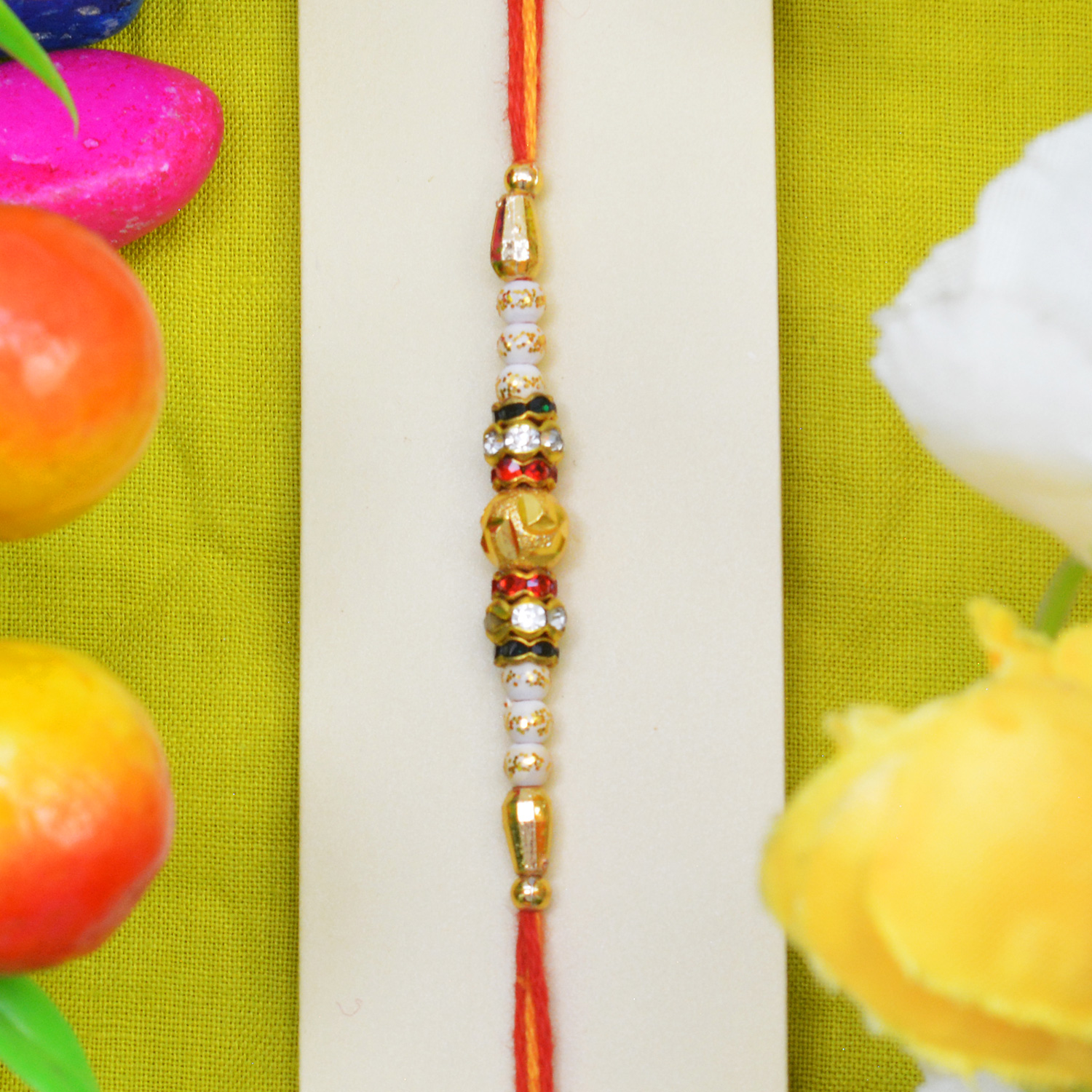 Golden and White Color Beads Rakhi with Red and White Jewel 