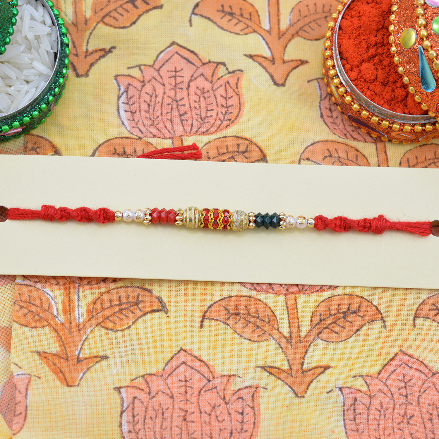Red, White and Black Color Beads with Red Jewel Rakhi