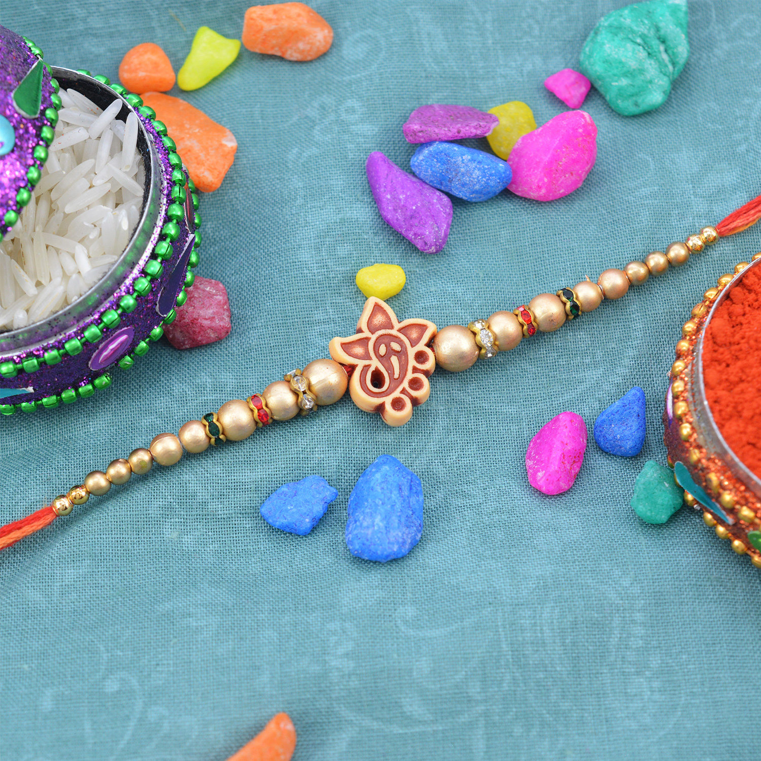 Breathtaking Cute Ganesha Rakhi with Jewel and Beads