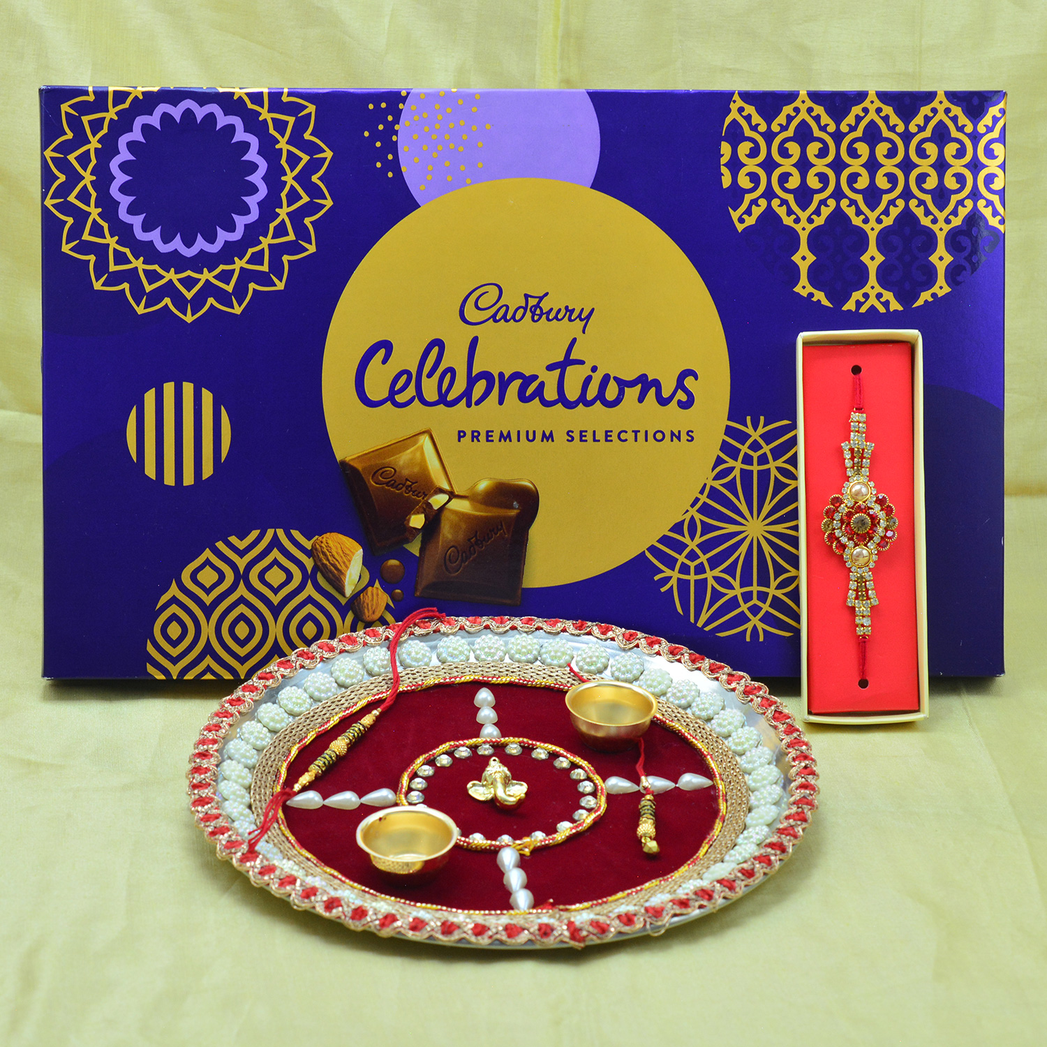 Premium Cadbury Celebration with Auspicious Rakhi Thalia and Rakhis Pooja Thali Hamper