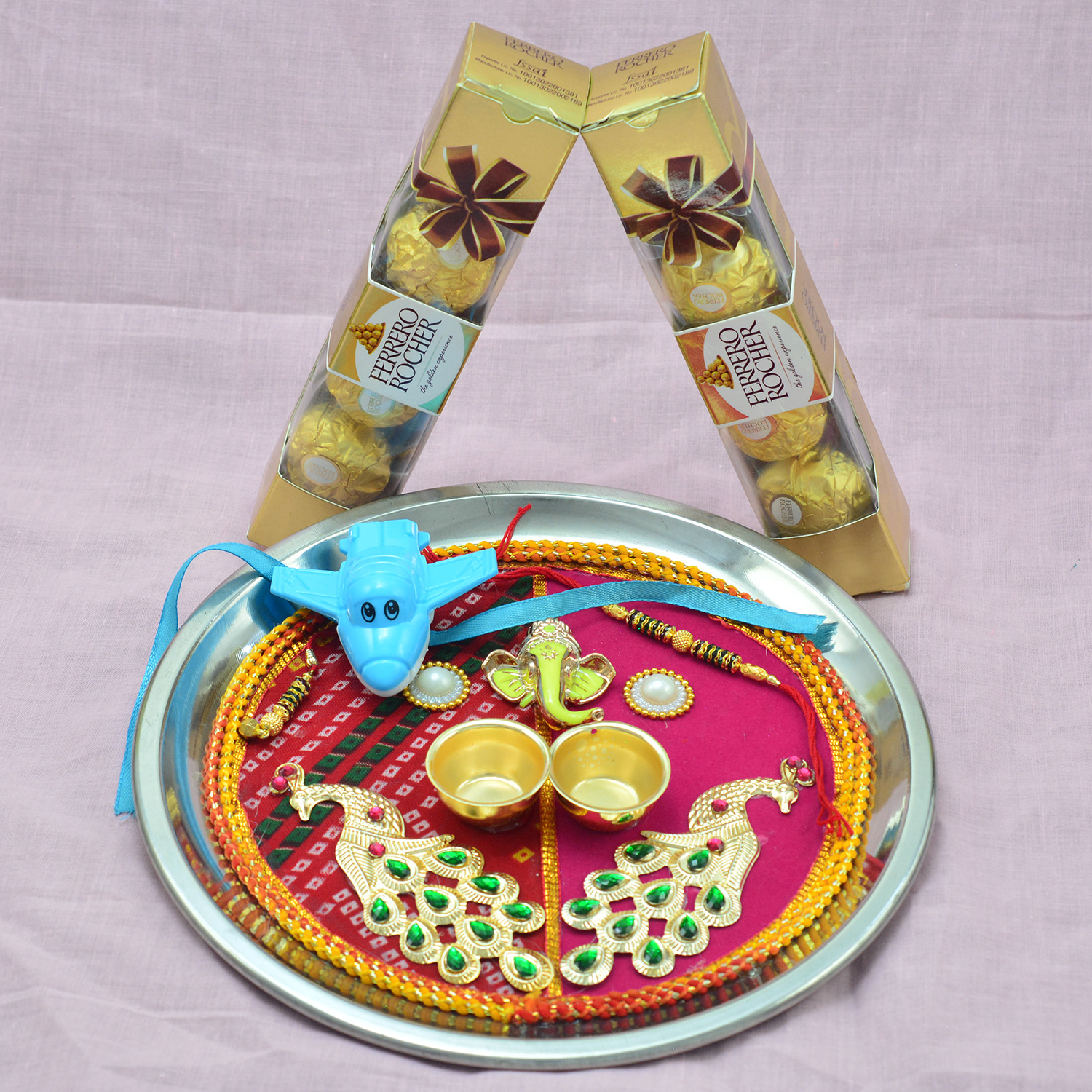 Ferrero Rocher Chocolates and Pick Colored Sacred Ganesha Rakhi Pooja Thali and Chocolates Hamper