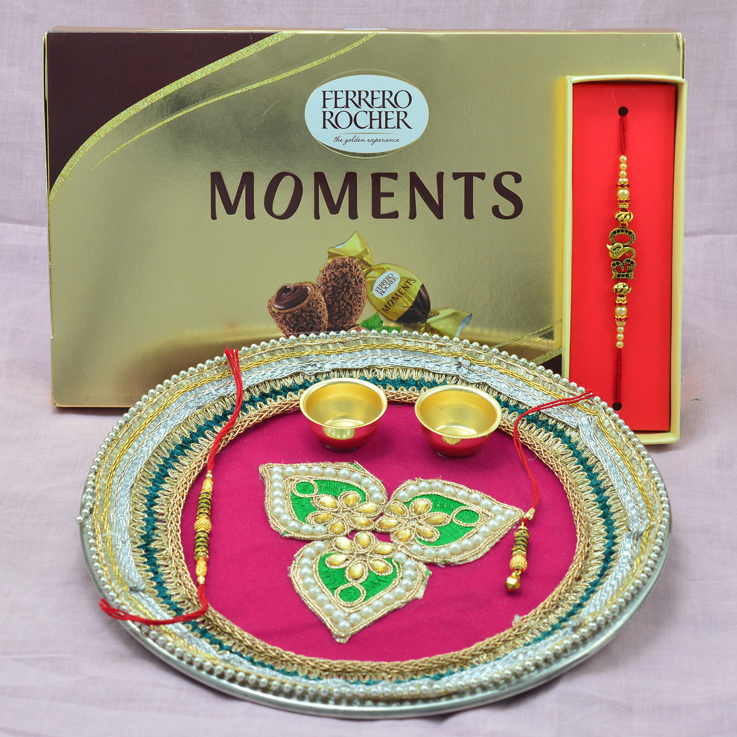 Pink Colored Magnificent Looking Rakhi Pooja Thali with Ferrero Rocher Moments Chocolate Hamper 