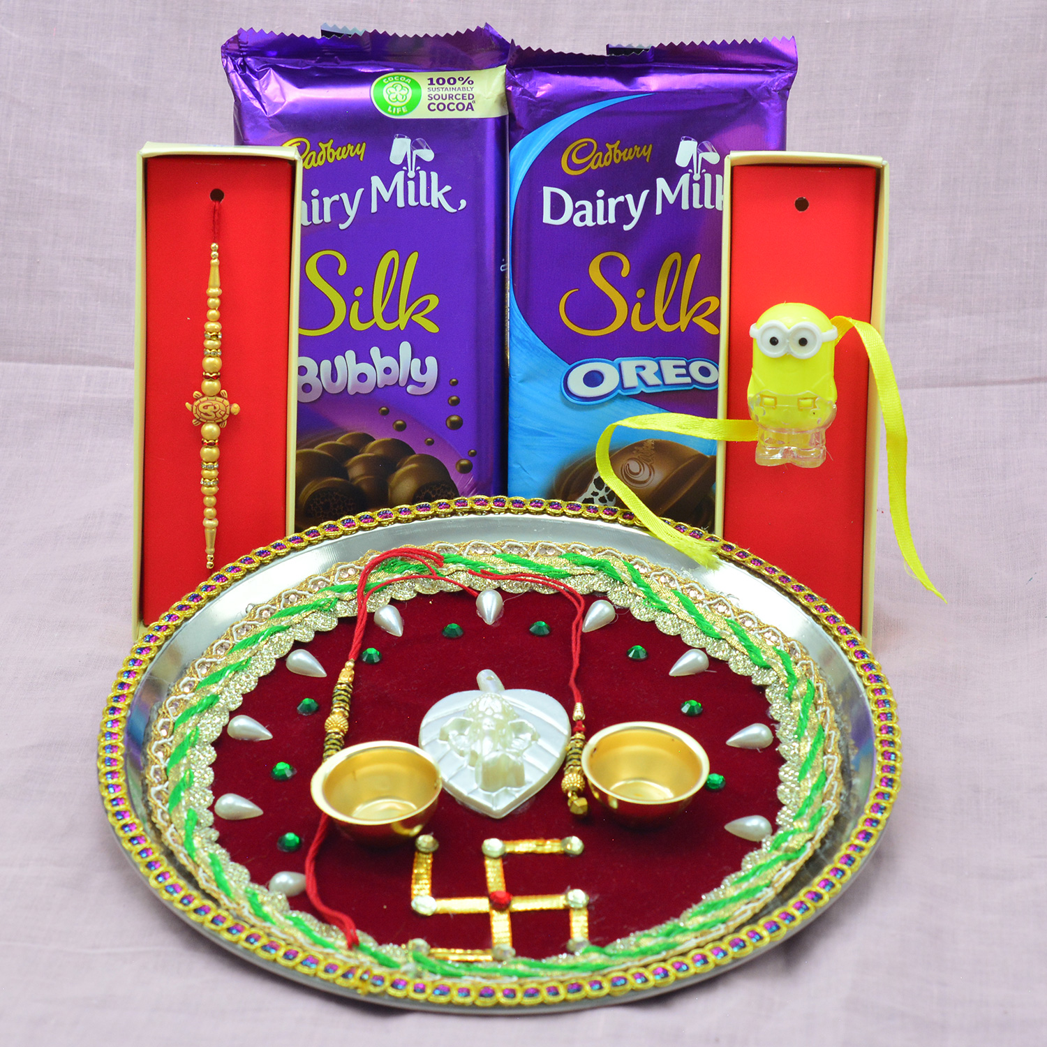 Dairy Milk Silk Combo Chocolates with Multiple Rakhis and Maroon Color Rakhi Puja Thali Hamper