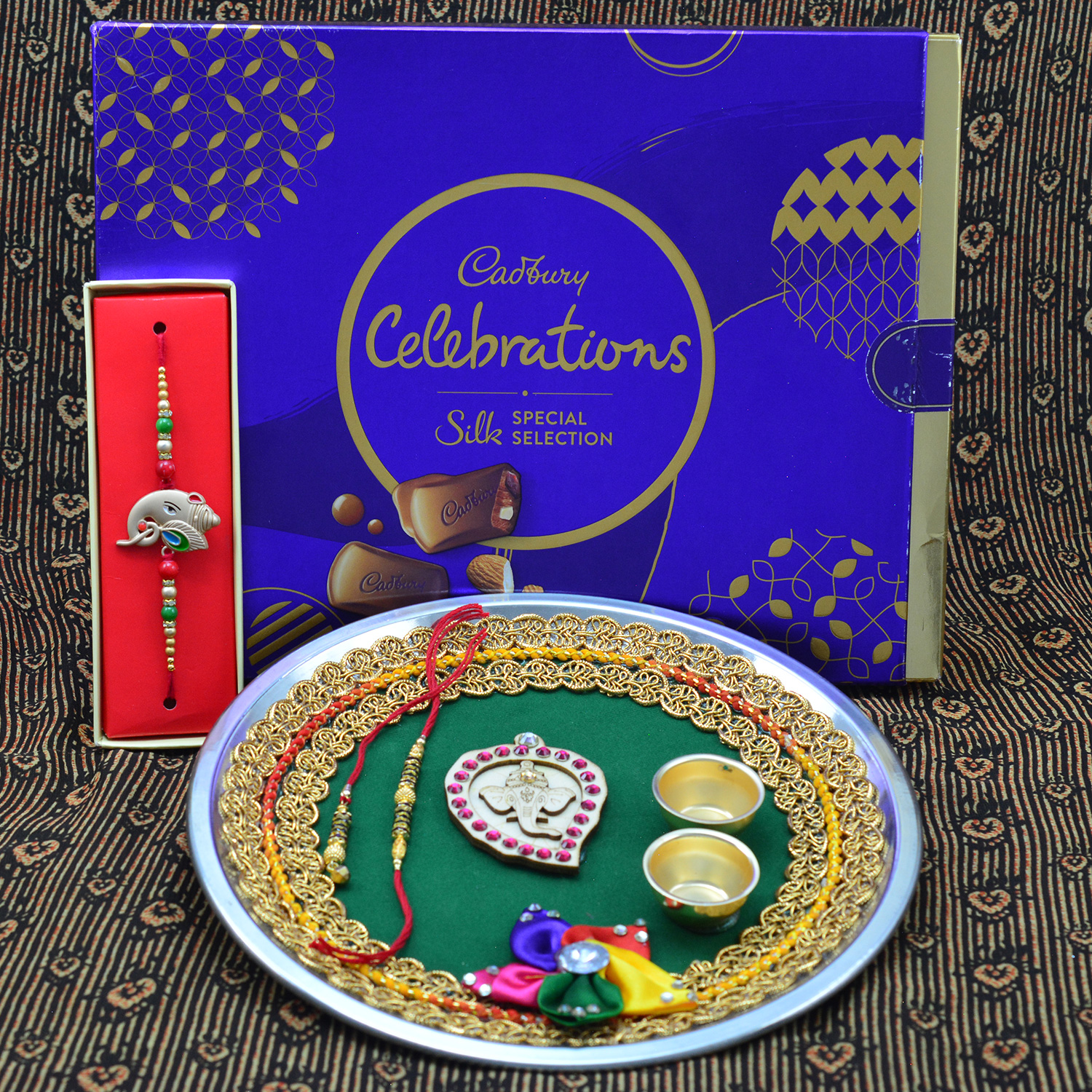 Cadbury Celebration New Small Pack Chocolate with Elegant Looking Rakhis and Pooja Thali Hamper