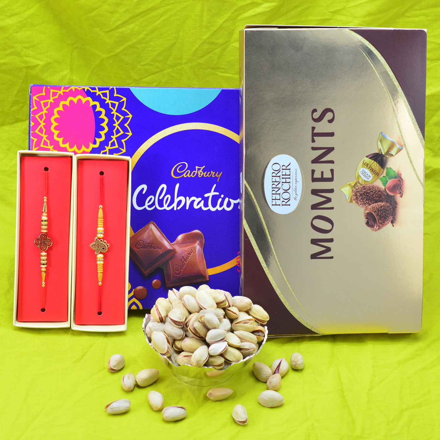 Ferrero Rocher Moments and Cadbury Celebration Hamper with 2 Brother Rakhis and Pista Dry Fruit