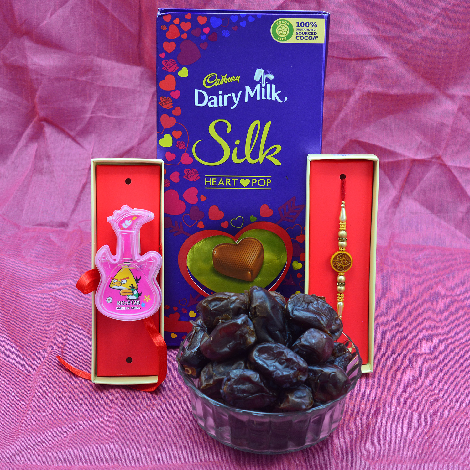 Cadbury Dairy Milk Silk Heart Pop with 1 Brother and Kid Rakhi and Pind Khajoor Dry Fruit