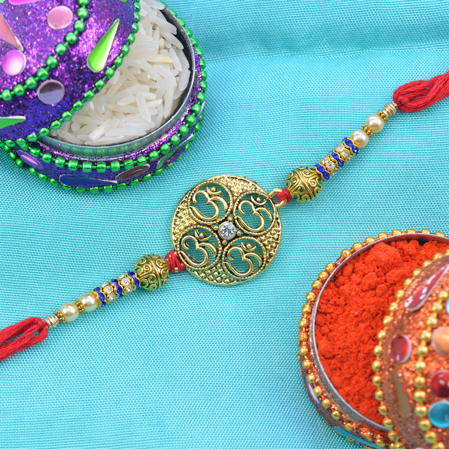 Four Om Circular Gold Pate with Jewel Designer Rakhi