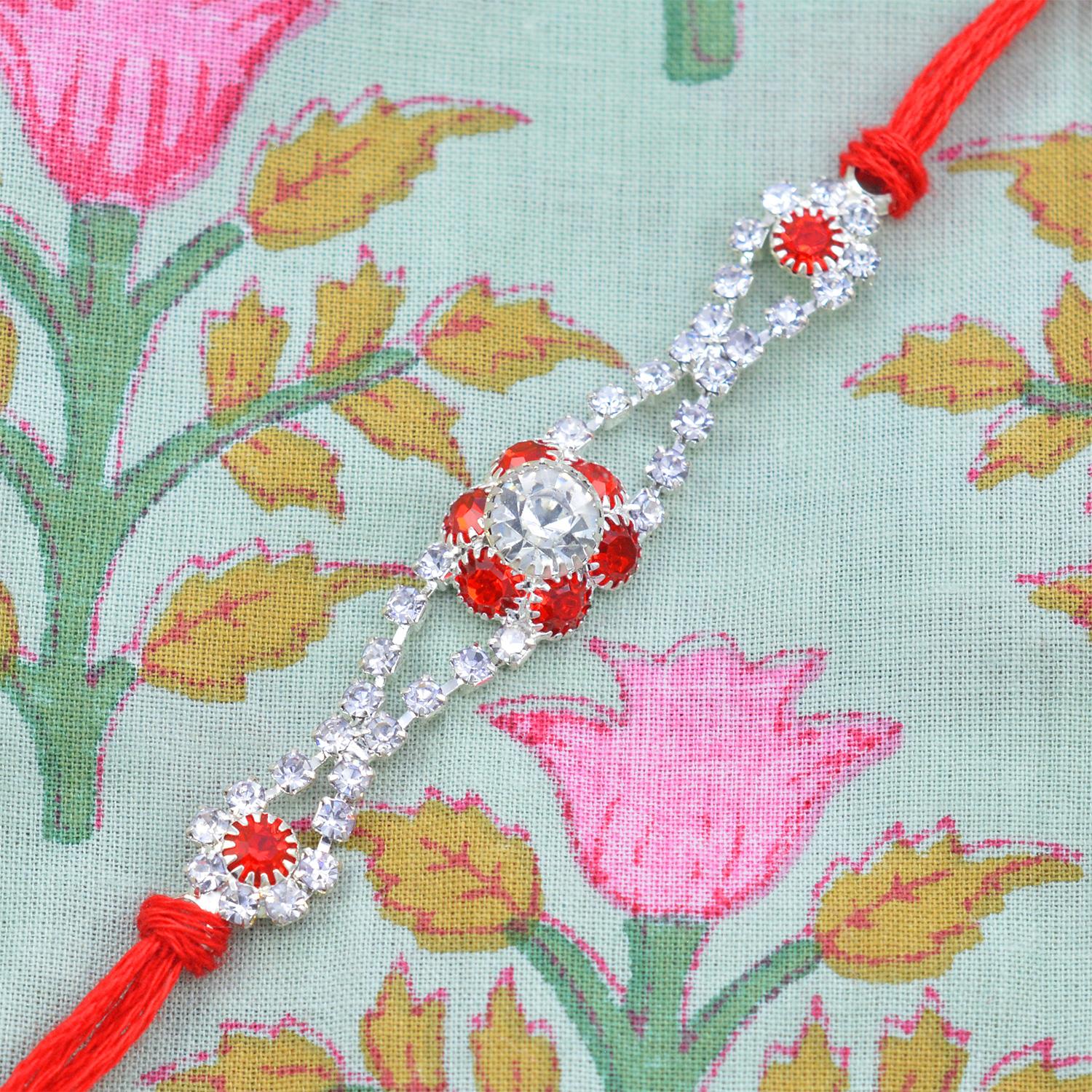 Alluring Flower Shape Multicolor Diamonds in Graceful Red Silk Thread