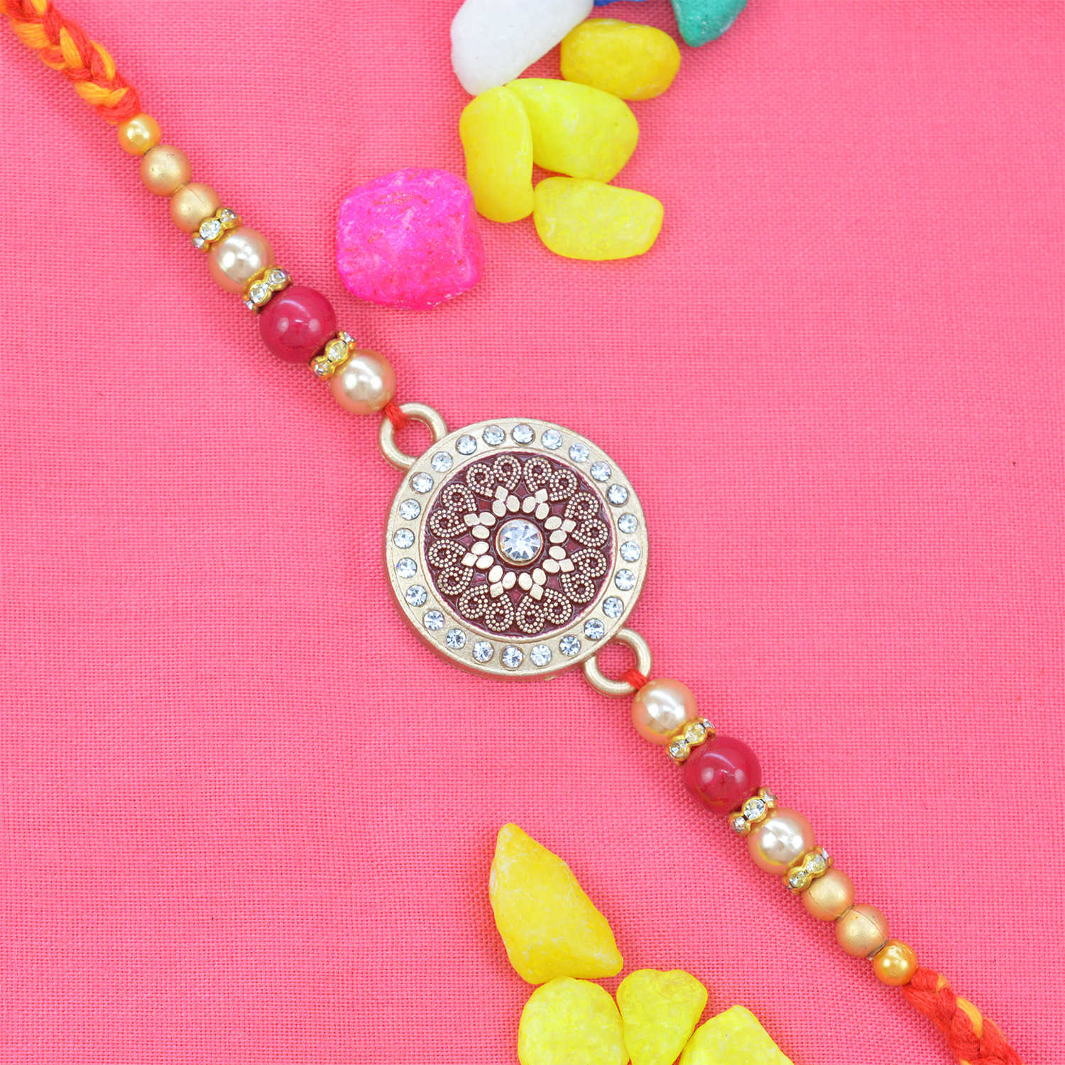 Flower in the Middle of Coin Shaped Pink Colored Rakhi