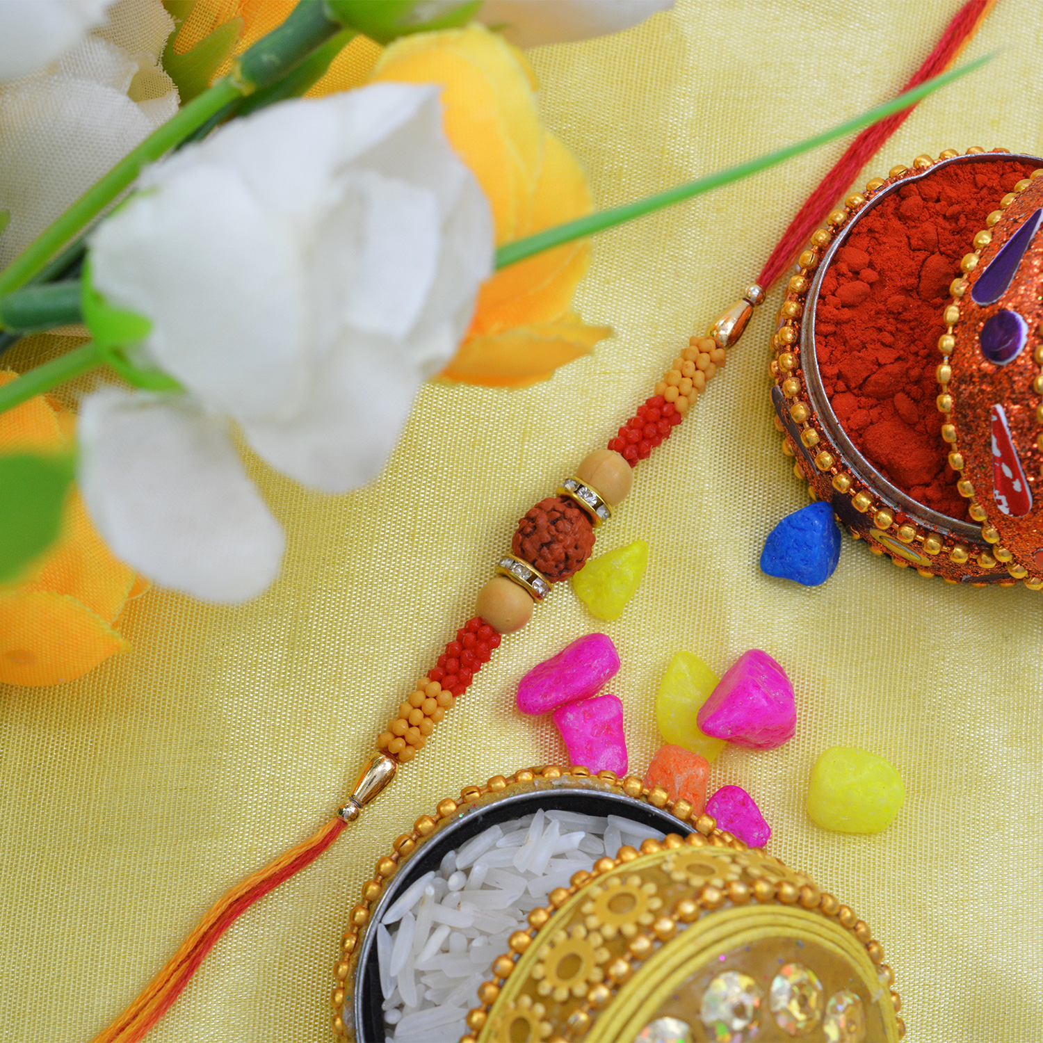 Dazzling Center Rudraksha Moli Rakhi with Multi-Color Silk Thread