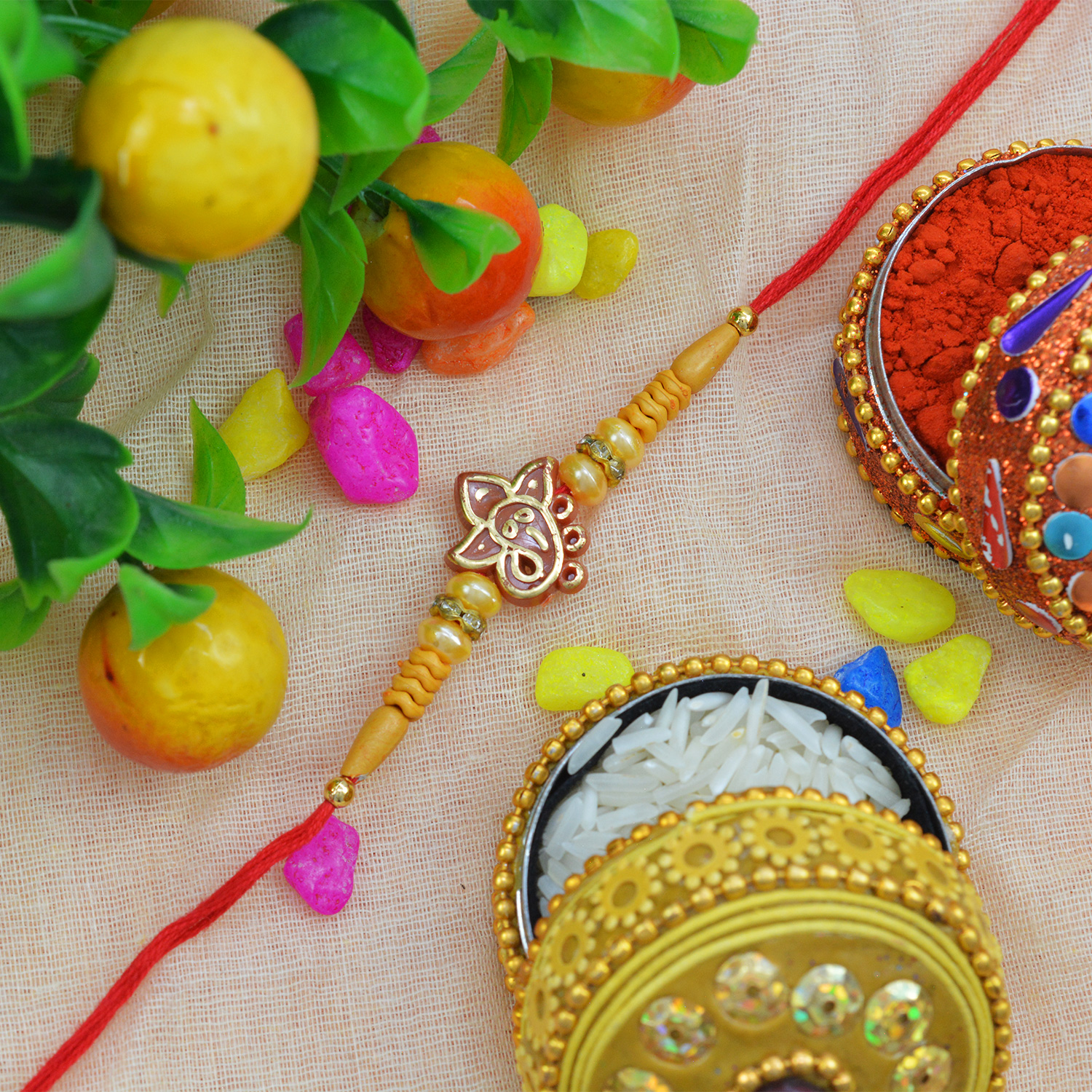 Alluring Shining Ganesh Moli-Dori Rakhi with Golden and Sandalwood Beads