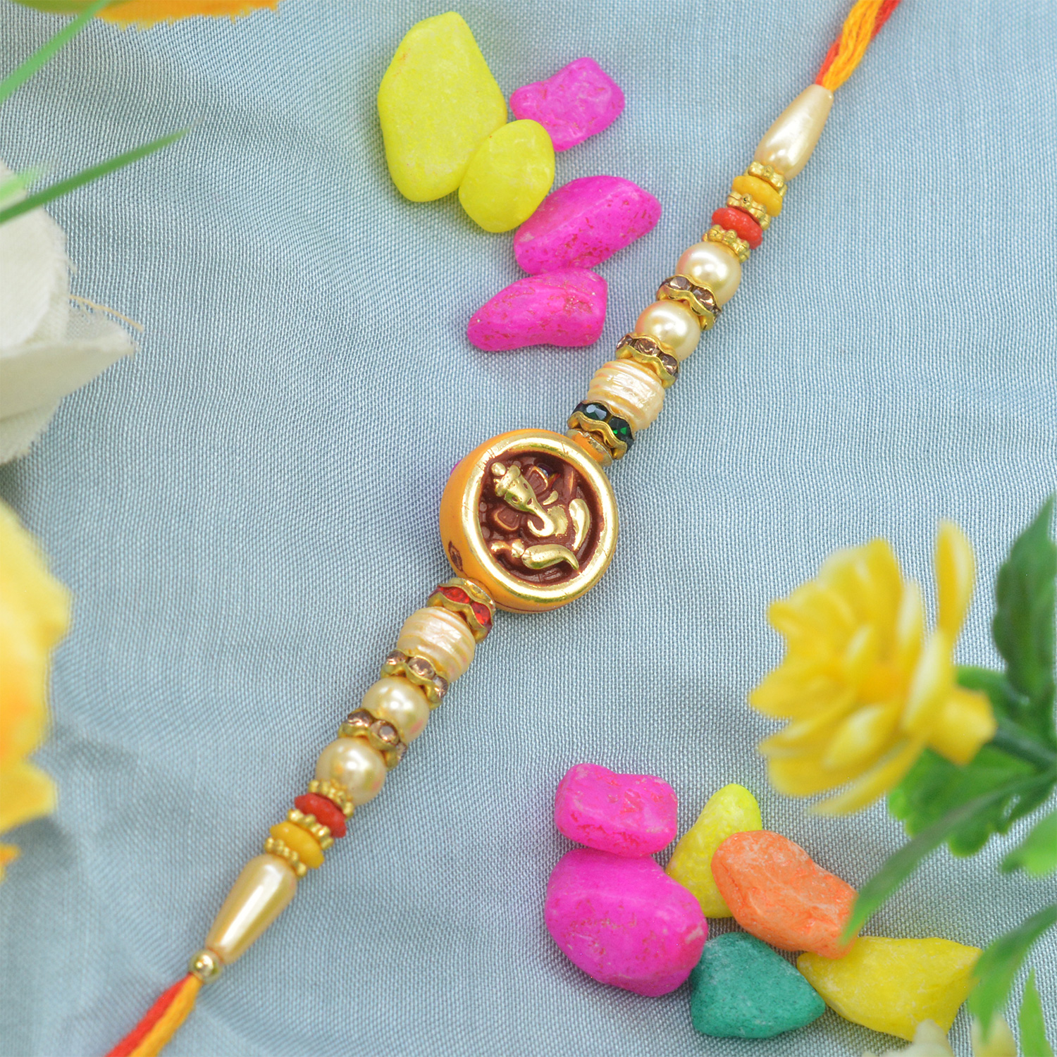 Amazing Golden Ganesh with Beautiful Multicolor Pearls in Colorful Thread