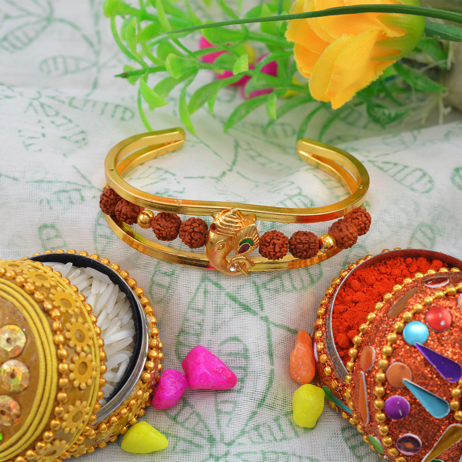 Alluring Golden Ganesh with Antique Rudraksha Rakhi Bracelet