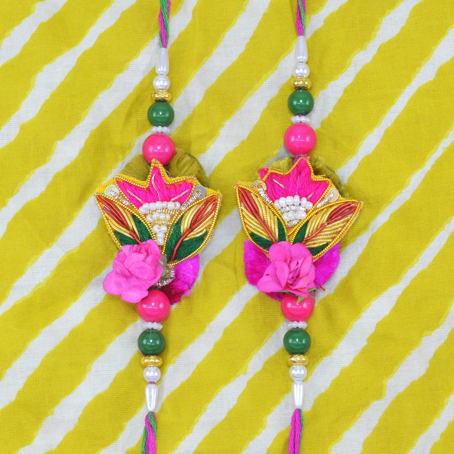 Same Design Rich Looking Zardosi Pink and Green Color Rakhis Set of 2