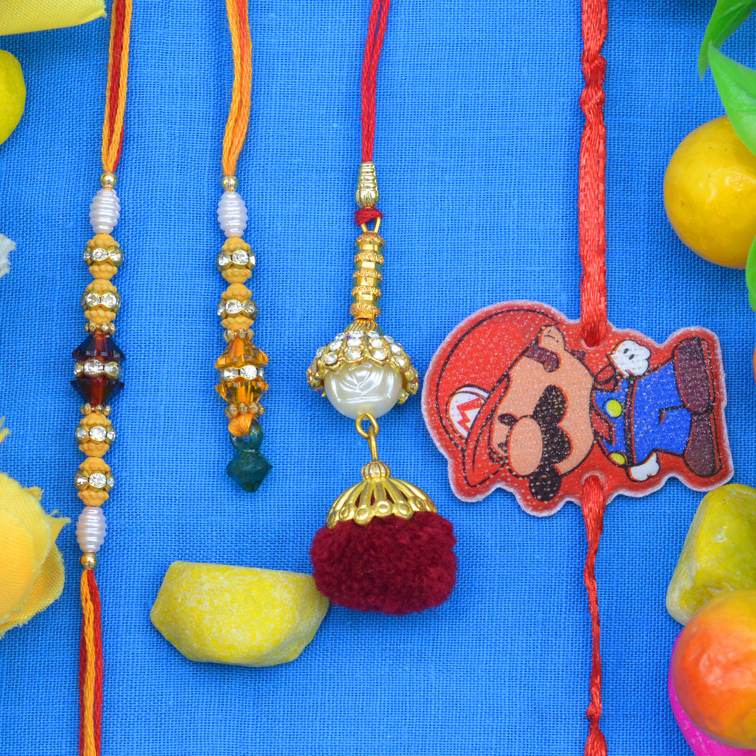 Two Different Designed Lumba Rakhis with One Khaki Color Brother Rakhi and One Mickey Mouse Kid Rakhis