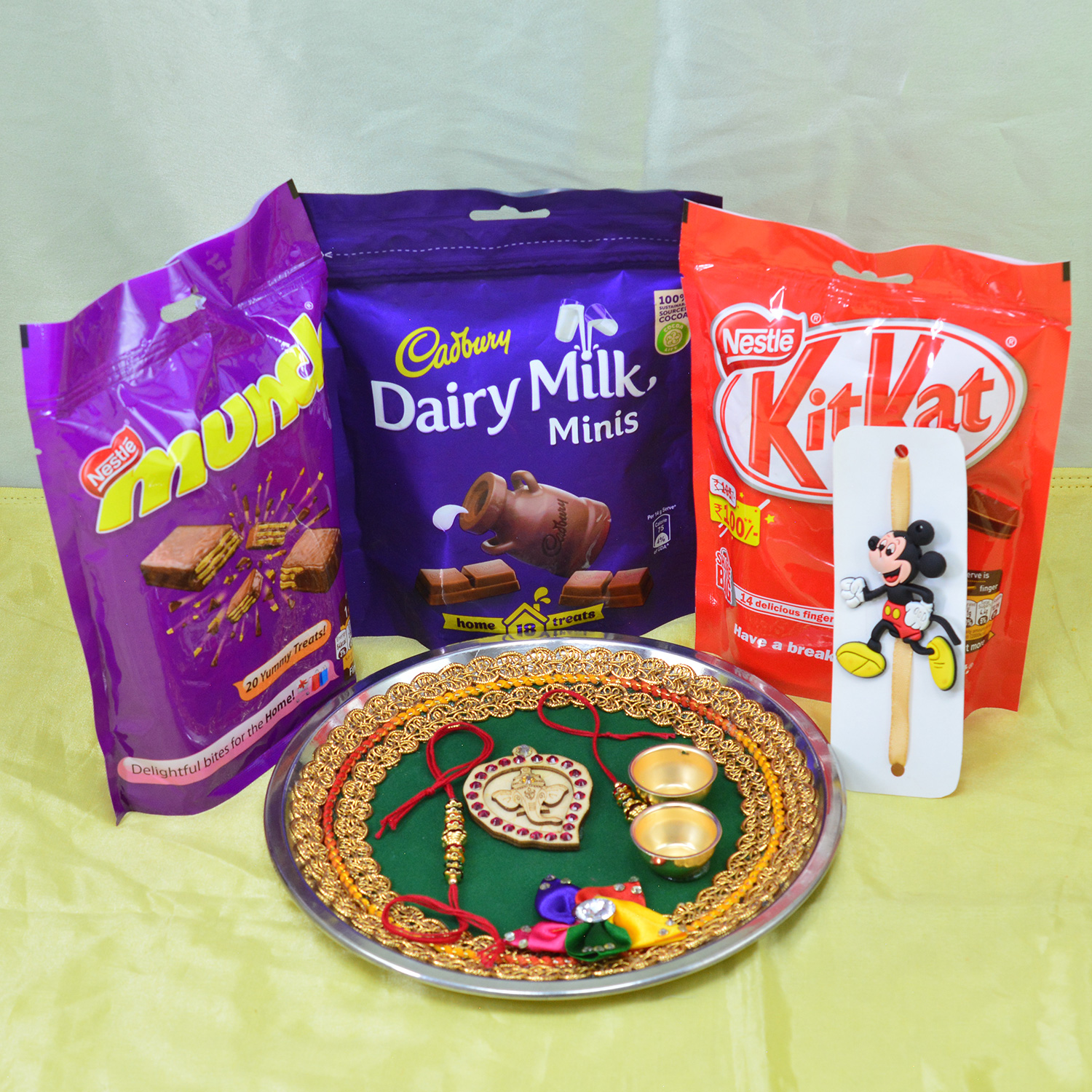 Munch Dairy Milk and Kitkat Pack of Chocolates with Divine Ganesha Rakhi Pooja Thali