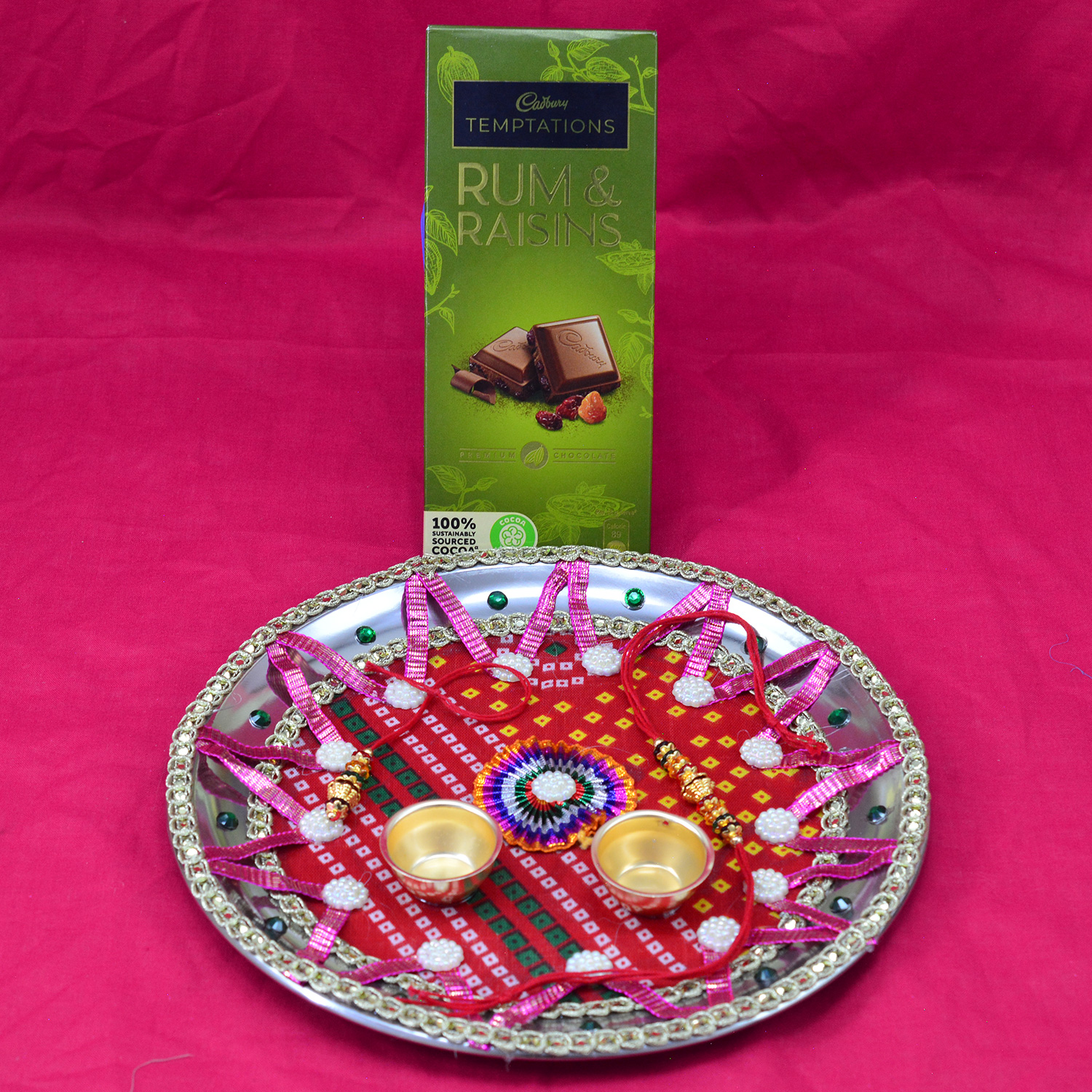 Rum Raisins Cadbury Chocolate with Flower in Mid Pink and Red Design Rakhi Puja Thali