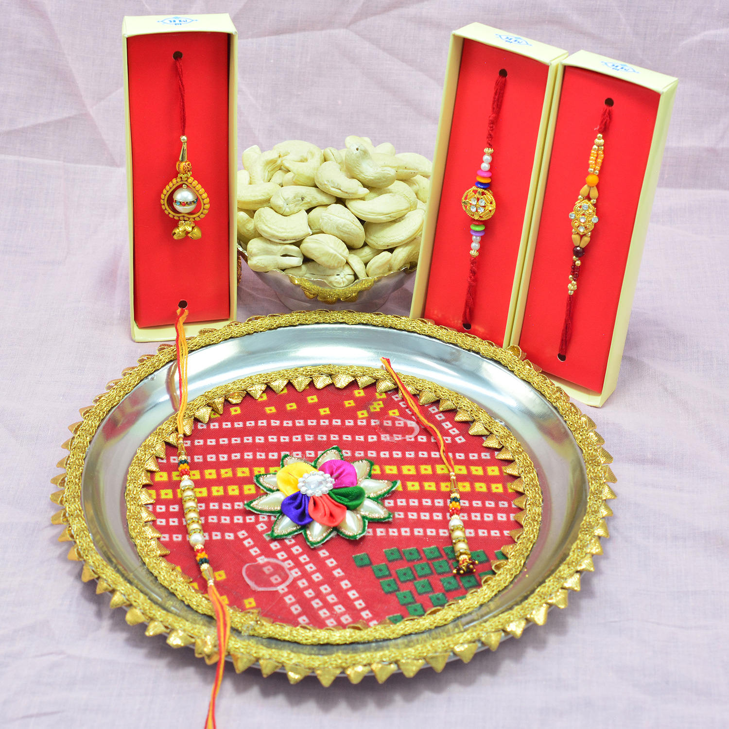 Rajasthani Design Flower in Mid Colorful Rakhi Pooja Thali with Rakhis and Fresh Kaju Dry Fruits Hamper