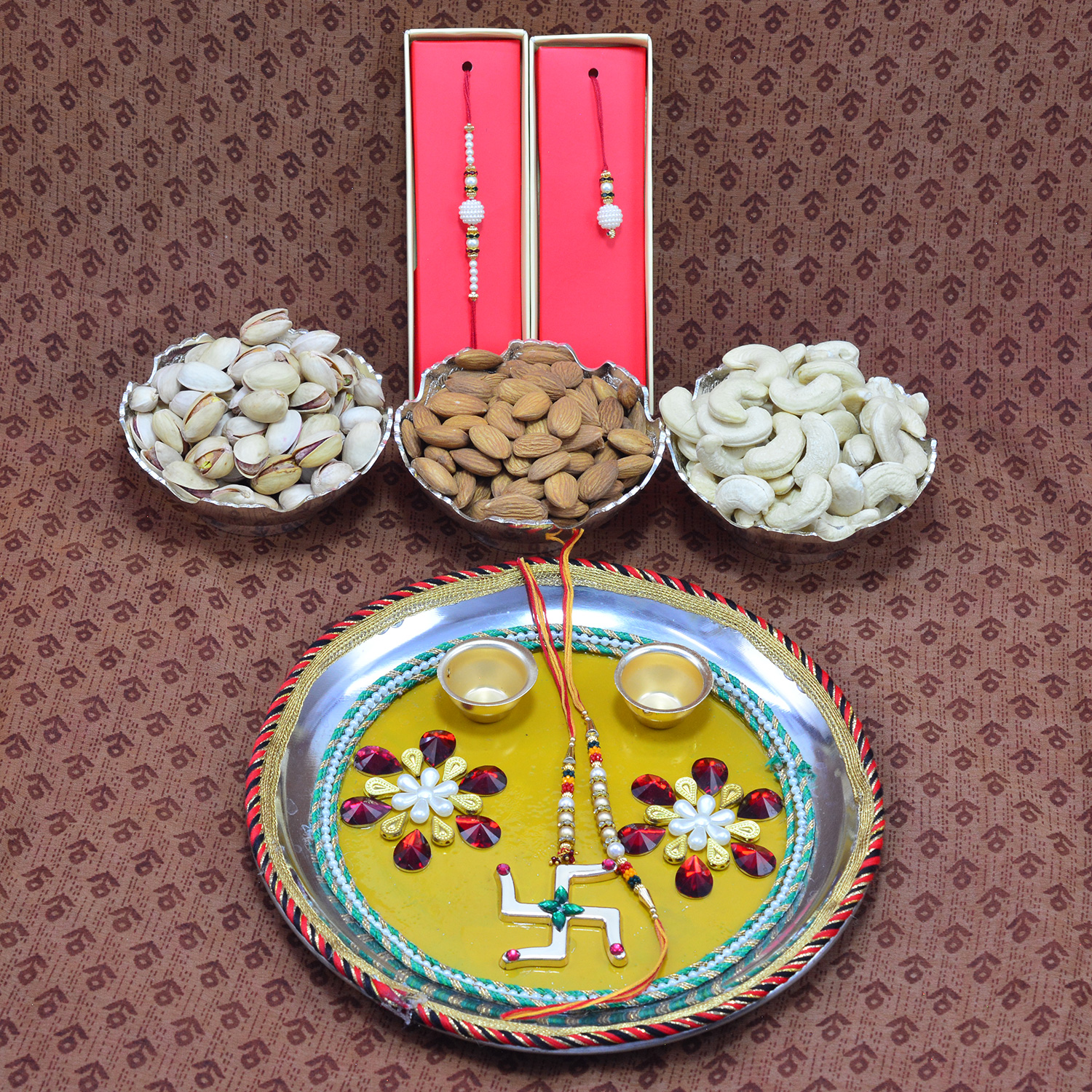 Gorgeous Swastik Design Rakhi Pooja Thali with 3 Types of Delicious Dry Fruits