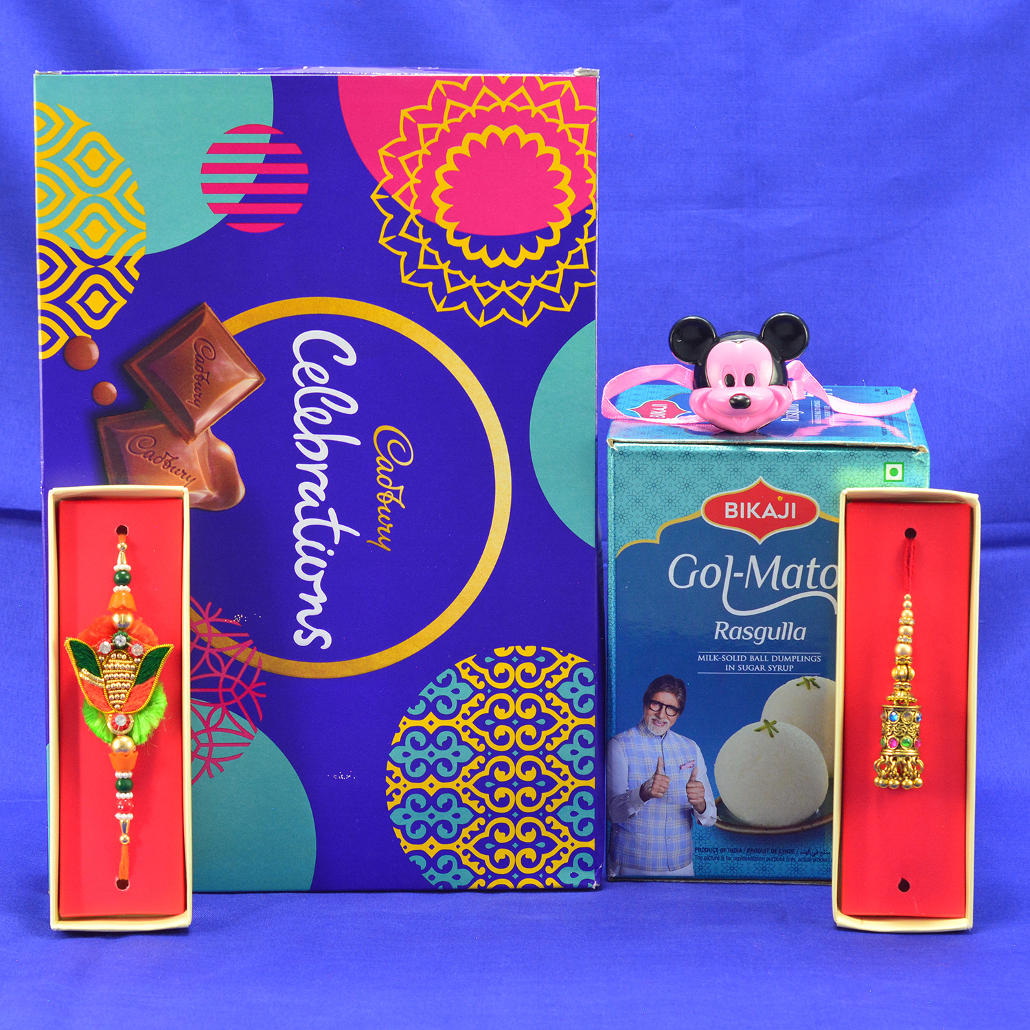 Amazing Designer Thread Bhaiya Bhabhi with Micky Rakhi with Yummy Bikaji Gol Matol Rasgulla and Cadbury Celebrations