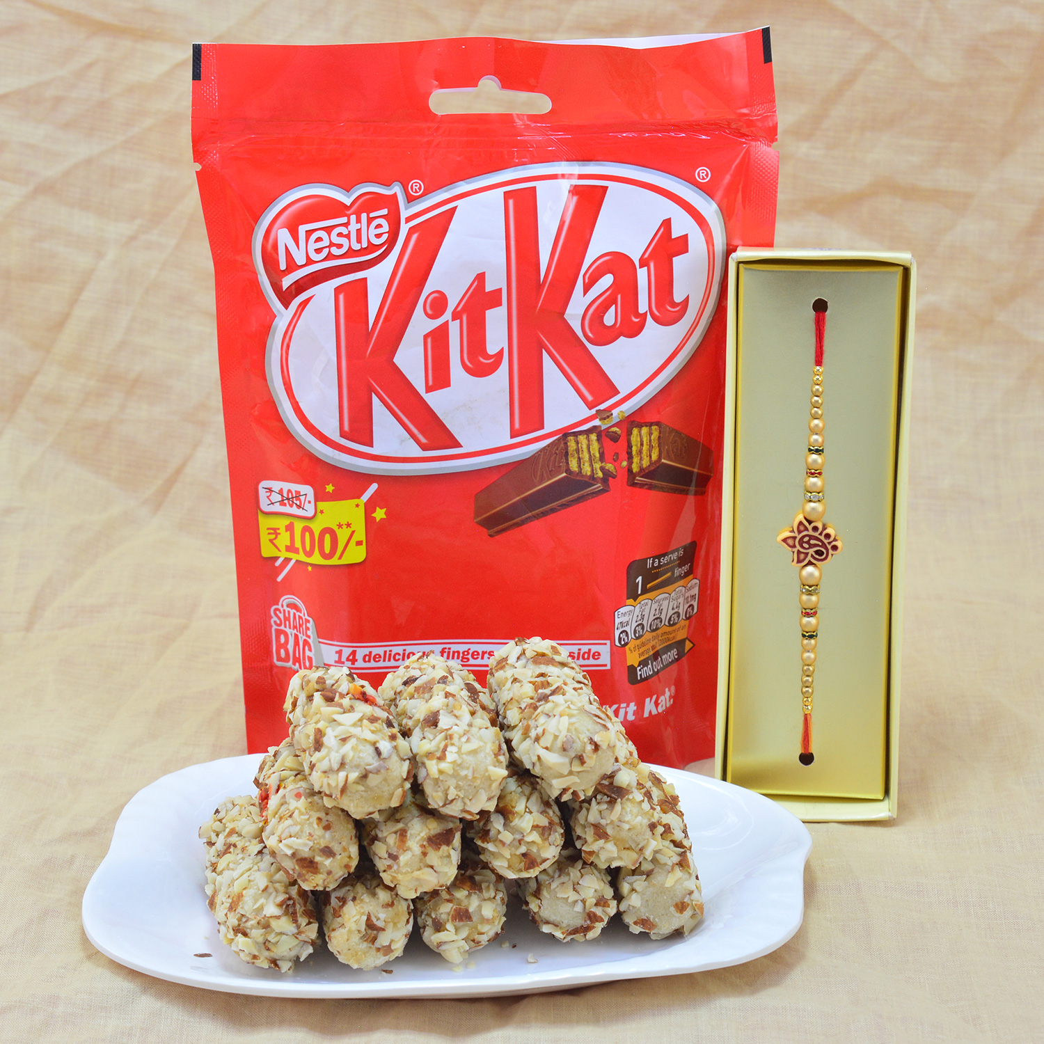 Amazing Beads Rakhi with Piquant Kaju Butterscotch Roll with Delicious Nestle Kitkat