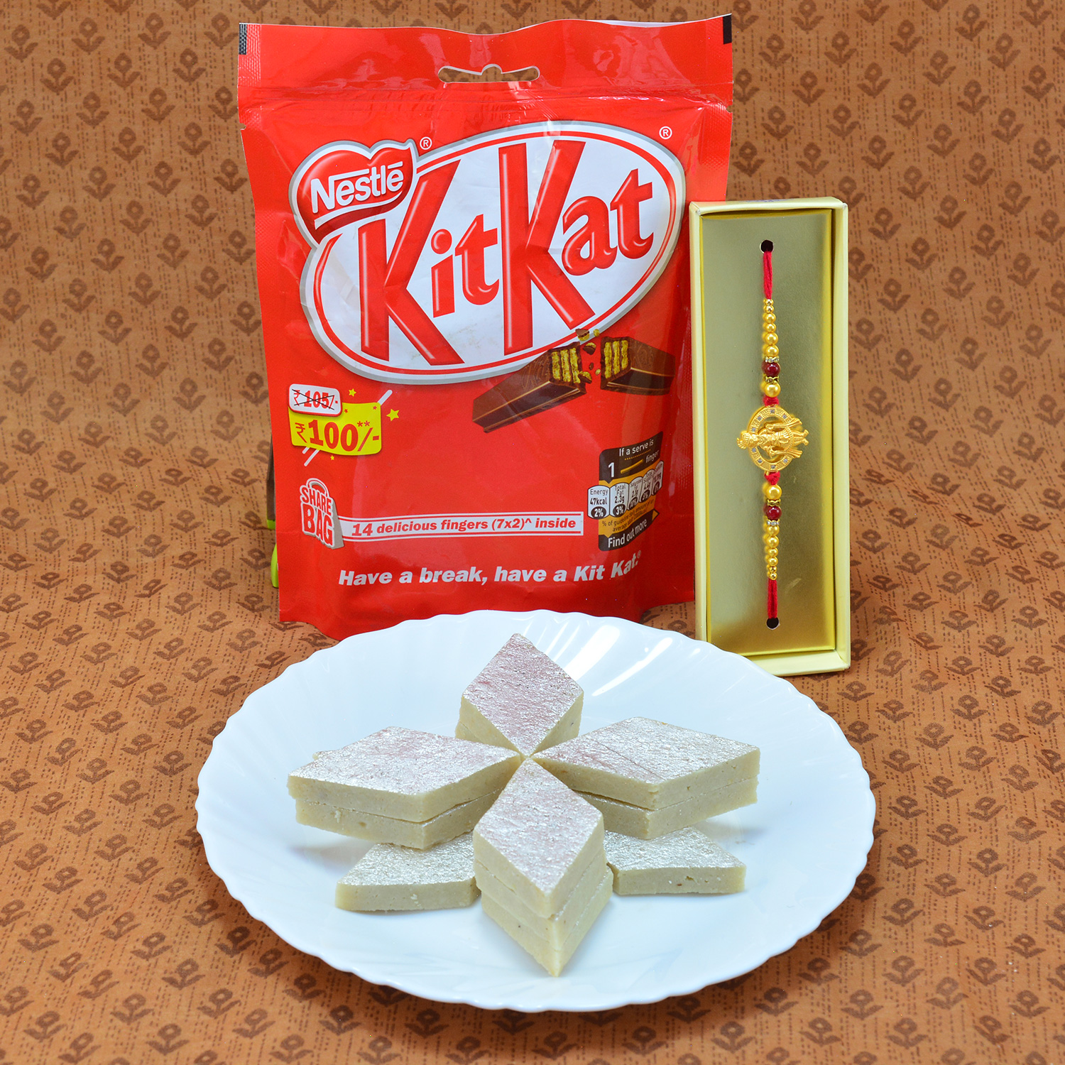 Amazing Eye Catching Diamond Beads Rakhi with Luscious Nestle Kitkat and Delicious Kaju Katli Hamper
