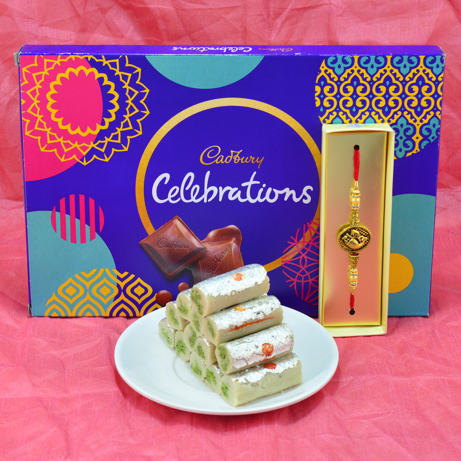 Amazing Eye Catching Rakhi with Yummy Cadbury Celebrations and savory Kaju Roll