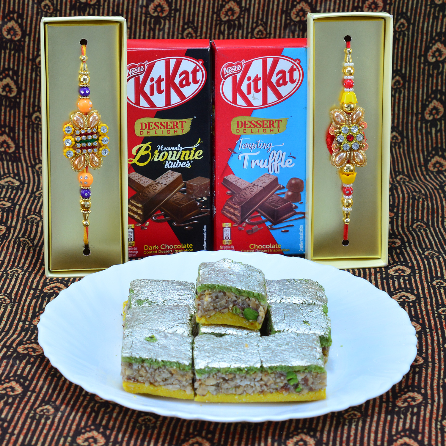 Magnificent Diamond Jewel Rich Look Zardosi Rakhi with Delicious Nestle Kitkat and Luscious Kaju Badam Barfi Hamper