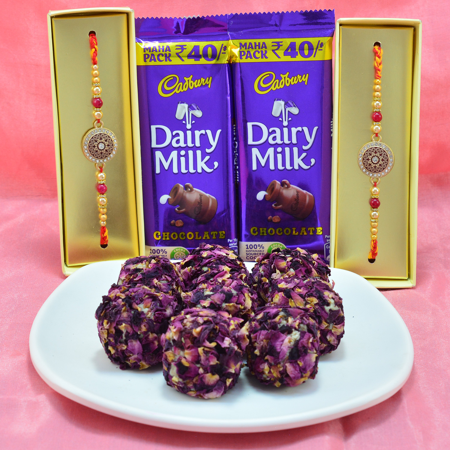 Fabulous Multicolor Rakhi with Savory Kaju Rose Laddu along with Delicious Cadbury Dairy Milk Hamper