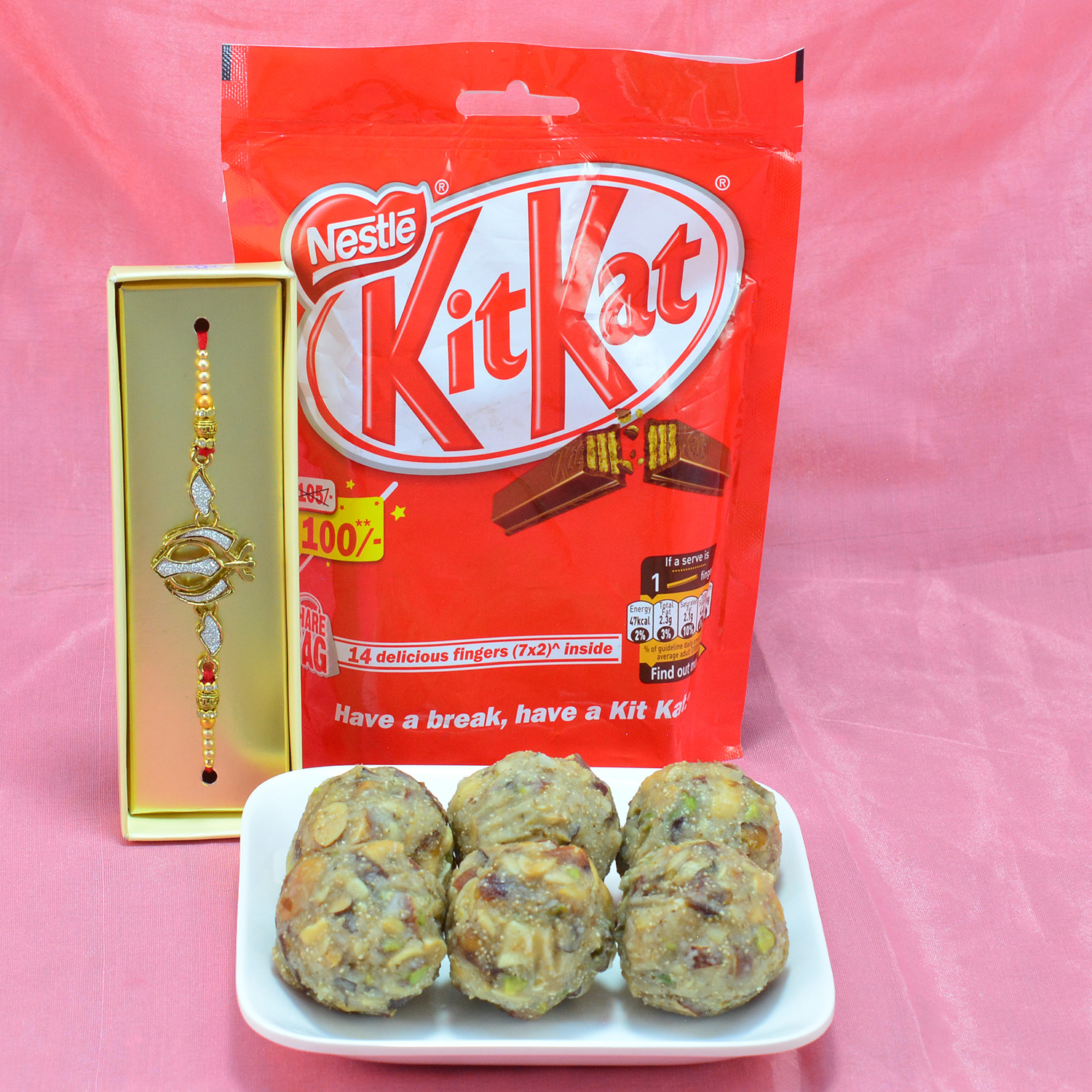 Delicious Nestle Kitkat with Captivating Dry Fruit Laddu along with Golden Sikh Rakhi Hamper