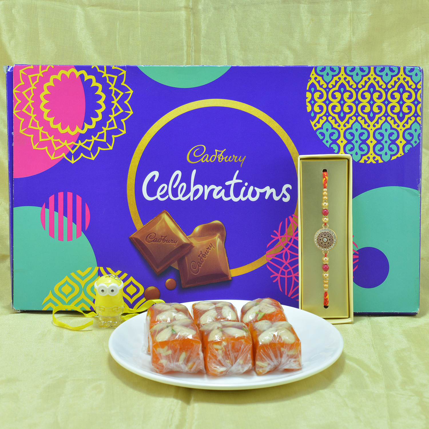 Piquant Cadbury Celebrations with Luscious Karachi Halwa along with Spectacular Beads Brother Rakhi Hamper