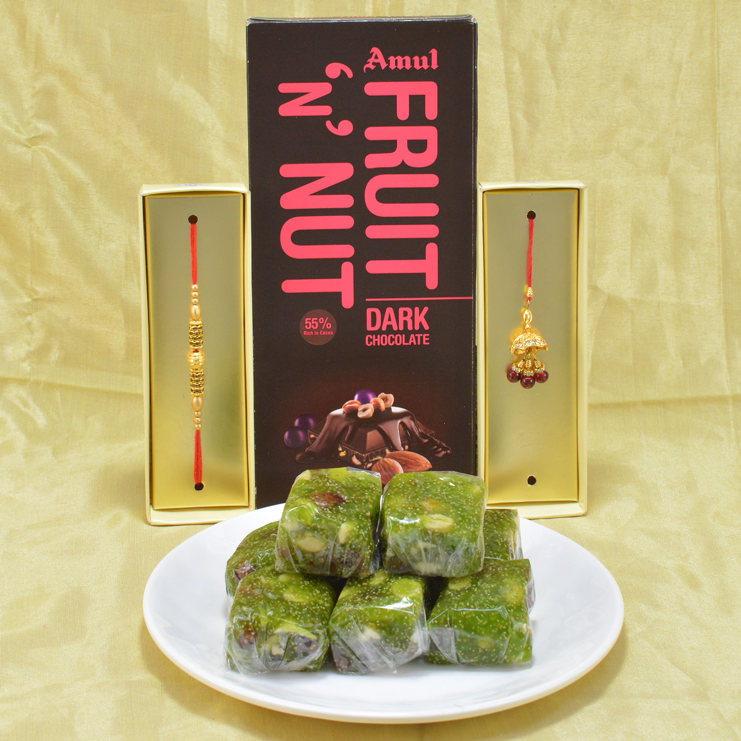 Amazing Golden Beads Bhaiya Bhabhi Rakhi with Delicious Kaju Anjeer Halwa along with Yummy Amul Dark Chocolate