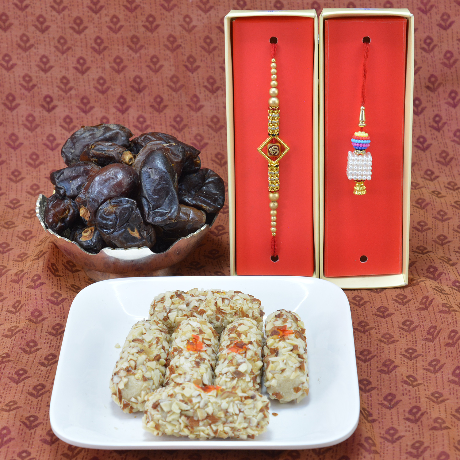 Appetizing Kaju Butterscotch Roll with Luscious Khajur Dryfruits along with Amazing Divine OM Rakhi with Stunning Lumba Beads Rakhi