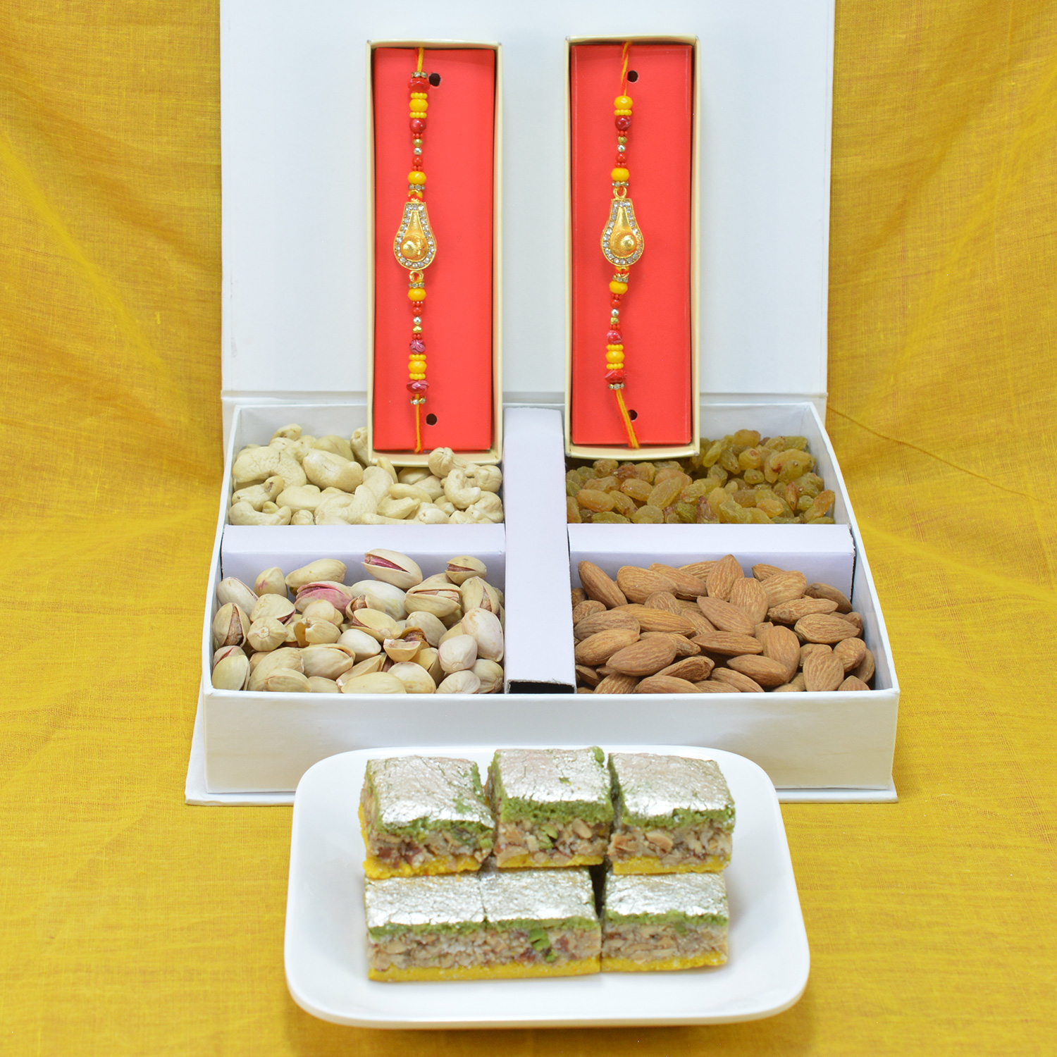 Piquant Badam Pista Barfi with Delicious 4 Type of Mix Dry Fruit along with Multicolor Beads Rakhi Hamper