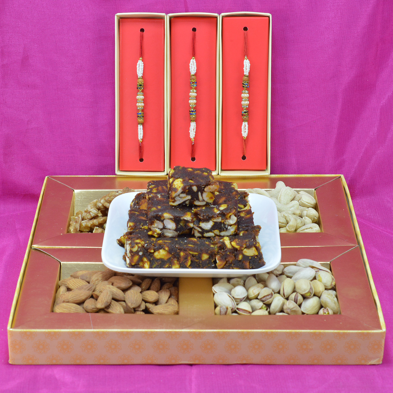 Appetizing Anjeer Dry Fruits with Tasty and Healty Mix Dry Fruit Box along with Multicolor Pearl Beads Rakhi  Hamper