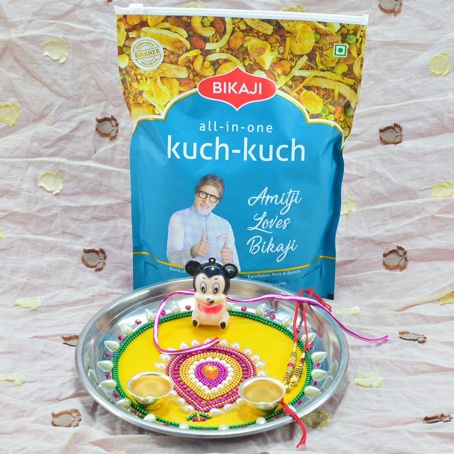 All in One Kuch Kuch Mixture Namkeen by Bikaji with Leaf Shape Design While Beaded Pooja Thali with Rakhis