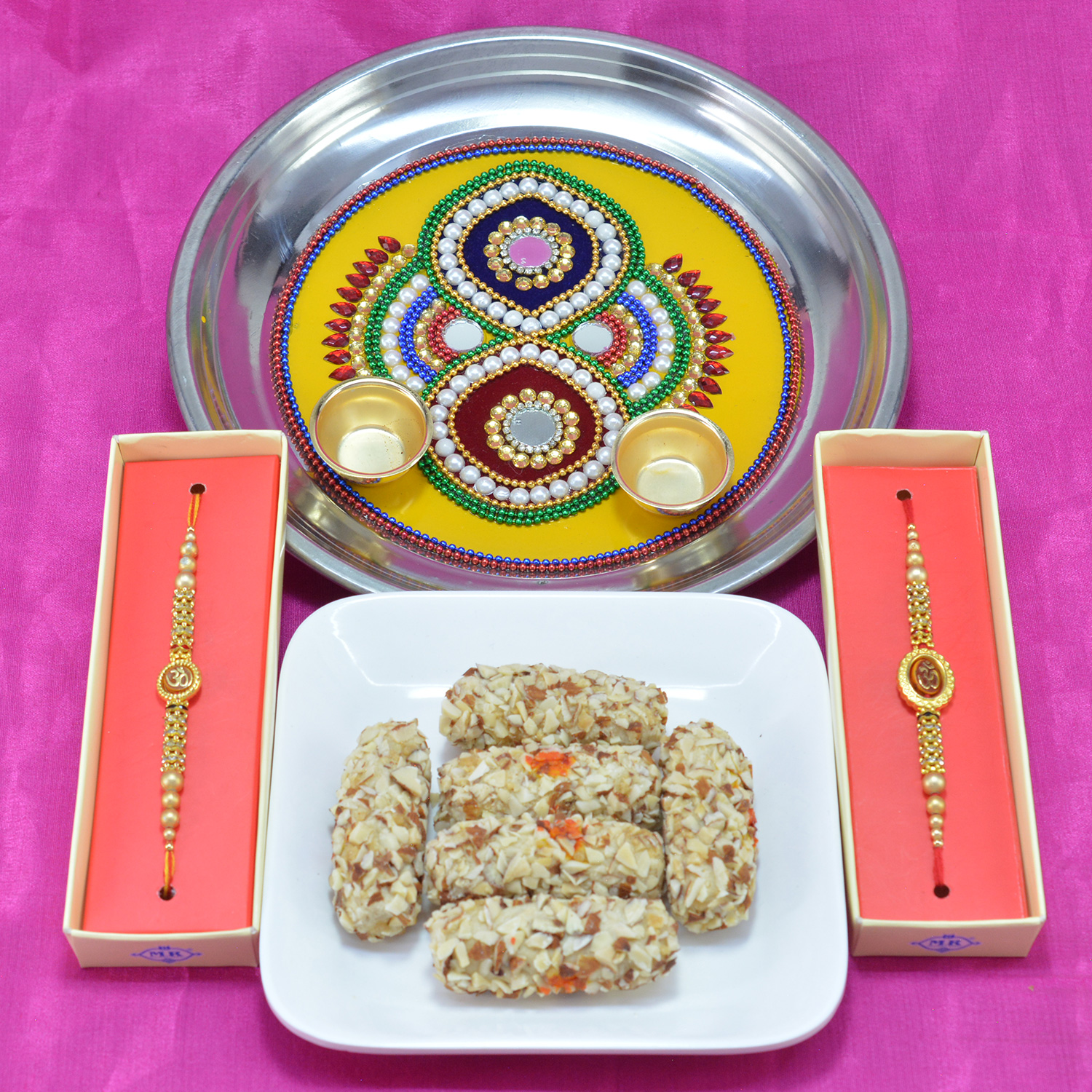 Amazing Multicolor Beads with Mirror Work Pooja Thali along with Tasty Kaju Butterscotch Roll and Divine Rakhi Hamper