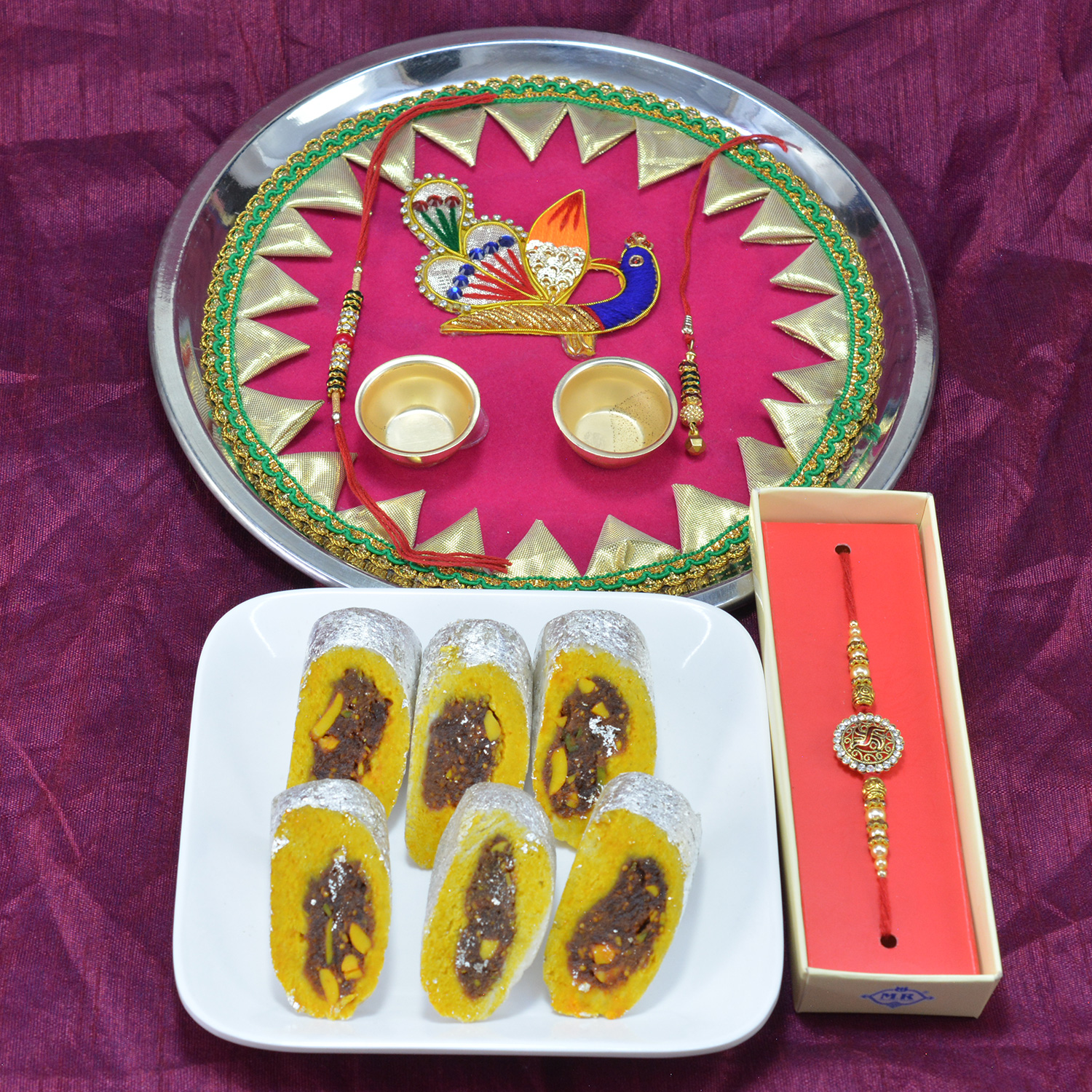 Marvelous Peacock Design Pooja Thali with Luscious Kaju Rajbahar along with Diamond Jewel Rakhi