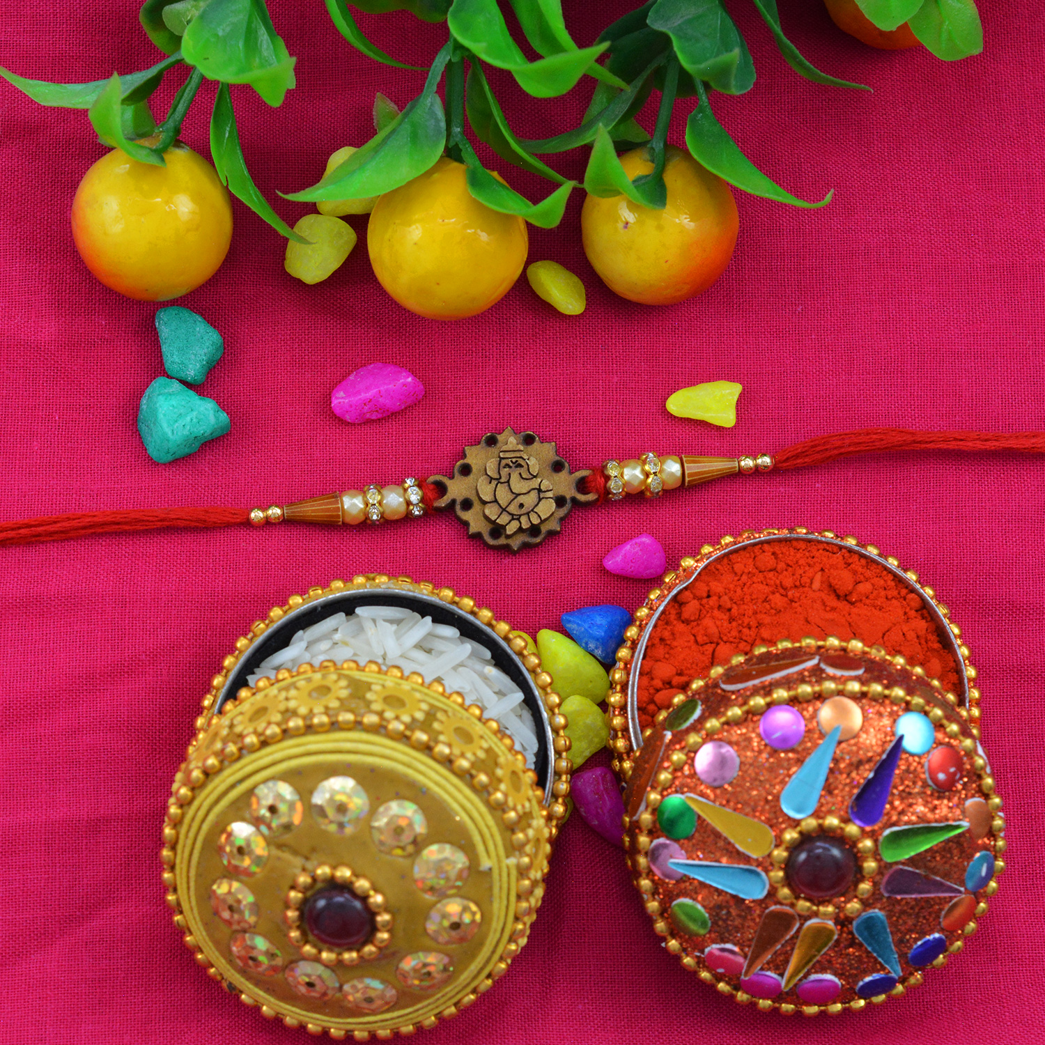 Graceful Rounded Ganesh Sandalwood Rakhi with Shining Beads