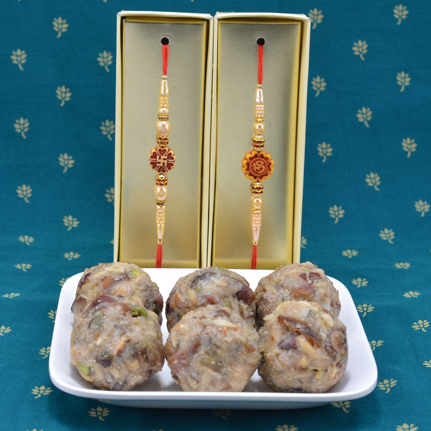 Divine Om and Swastika Rakhi Set for 2 Brothers with Delicious Sweet of Kaju Dry Fruit Laddu