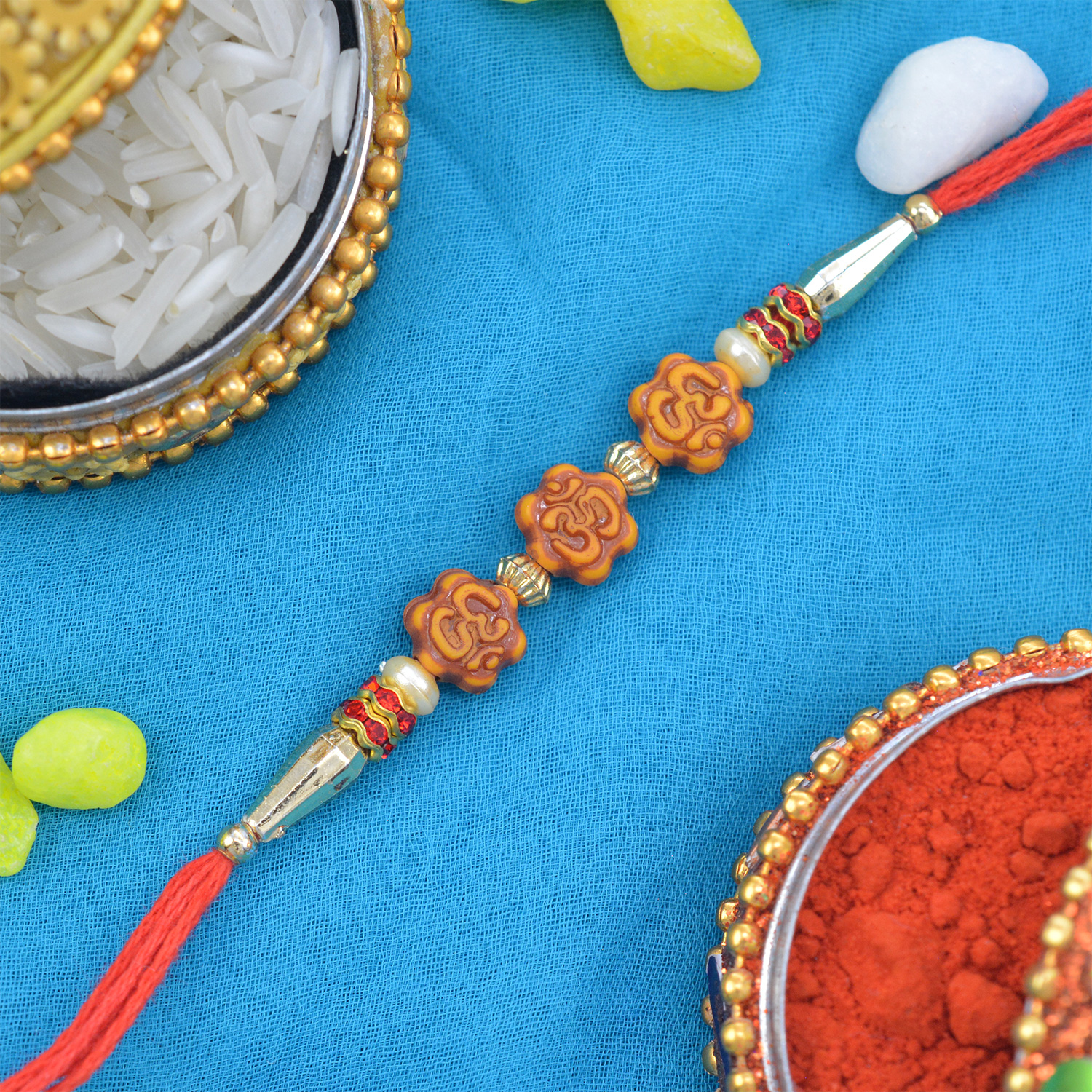 Auspicious Triple Om Rakhi with Stunning Beads