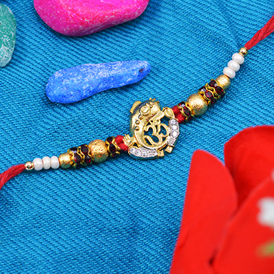 Om Ganesha Rakhi with golden pearls and diamonds